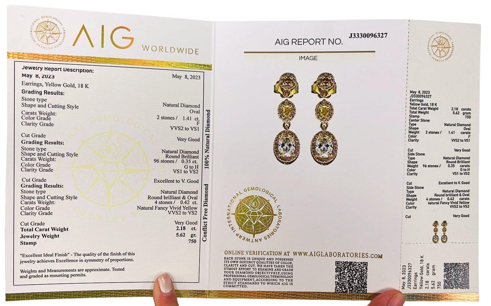 A stylish pair of three-layered earrings with dazzling 1.41-carat oval natural diamonds. It has 0.77 carats of side diamonds which add more to its elegance. The jewelry is made of 18K Yellow Gold with a high-quality polish. It comes with an AIG