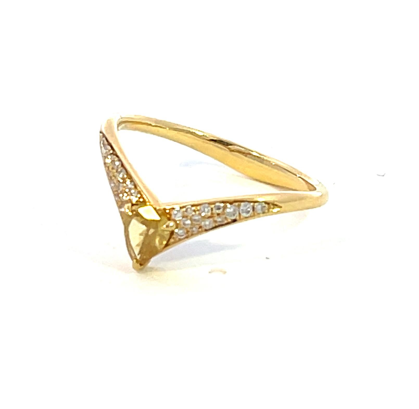 The ring is set in 18K Yellow Gold with One (1) Pear Shape Fancy Yellow weighing 0.27ctw (SI in Clarity) as the center. There are one row of diamonds on each sides 0.10ctw (26 Round Brilliant Cut Diamonds). 

It is currently sized at a size 7 but