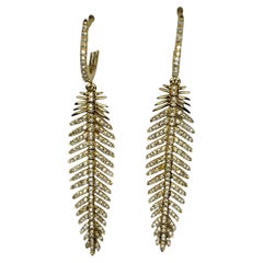 Orecchini a goccia con piume in oro giallo 18K