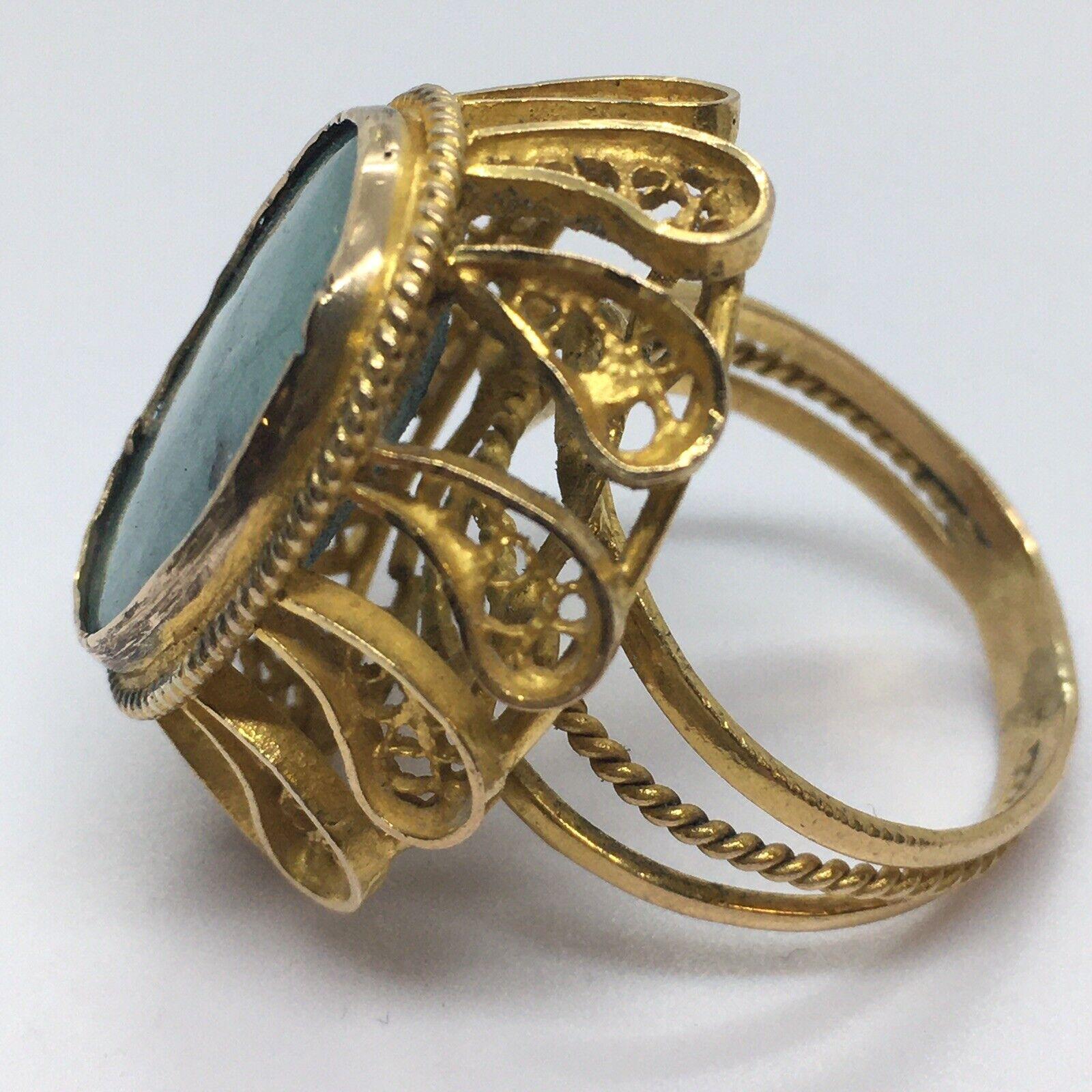 18k Yellow Gold Filigree Natural Turquoise Ring 30 mm Top 12.8 gram size 7



Size: 7 
Weight: 12.8 gram
Measurement 30 mm top north south side, bottom shank 4 mm
Stone Measurement  Natural Turquoise 21 mm by 16mm
Shape: Openwork tapered shank