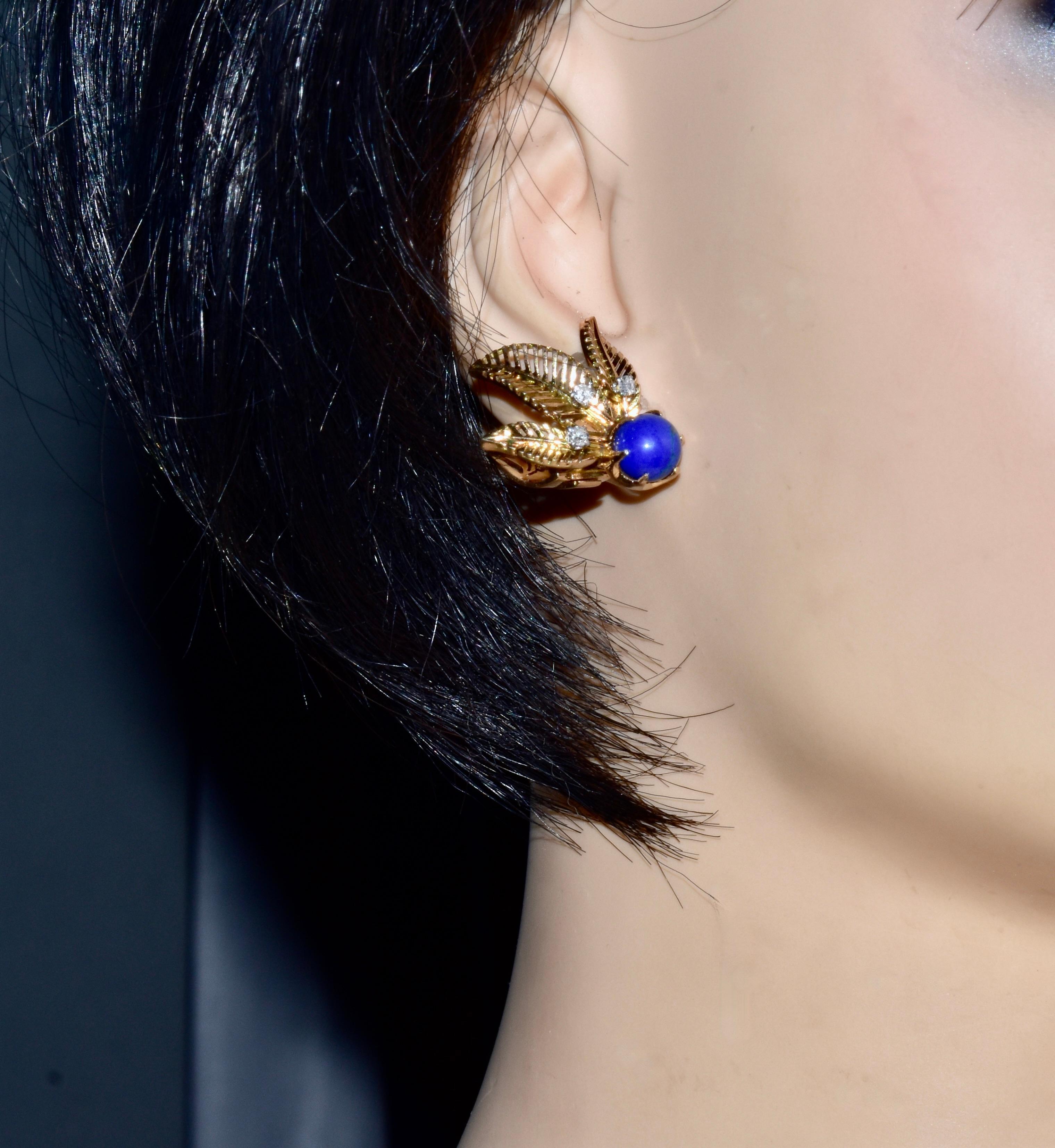 18K Yellow Gold Earrings in a leaf motif with fine bright blue lapis lazuli spheres measuring 7.3 mm (5.94 cts.), and 6 single cut round white diamonds estimated to weigh .20 cts. The diamonds are all near colorless, H and very slightly