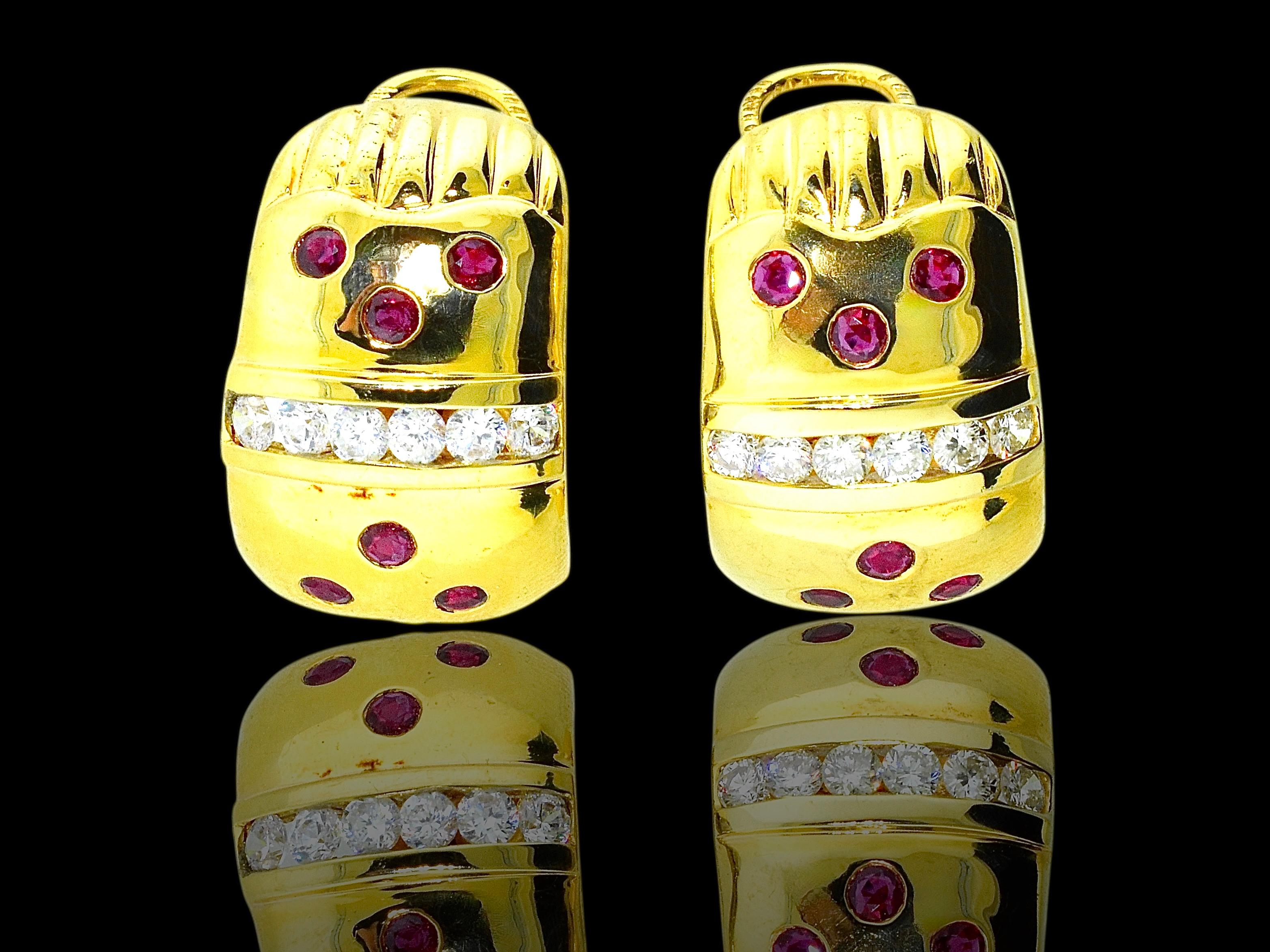 Diamond, ruby and 18K yellow gold earrings weighing 24.62 grams. They have 12 natural red rubies which weigh approximately 1.10 cts., and 12 diamonds weighing 1.2 cts. These round brilliant cut diamonds are well cut and graded as approximately (H),