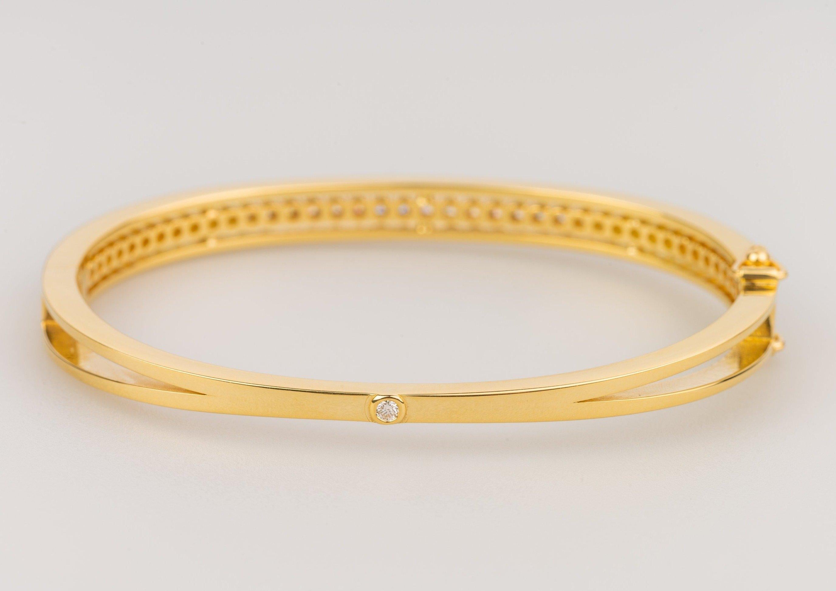 An 18k yellow gold bracelet featuring 40 round full cut white diamonds F color VS clarity 1.20 total carat weight, part of the 