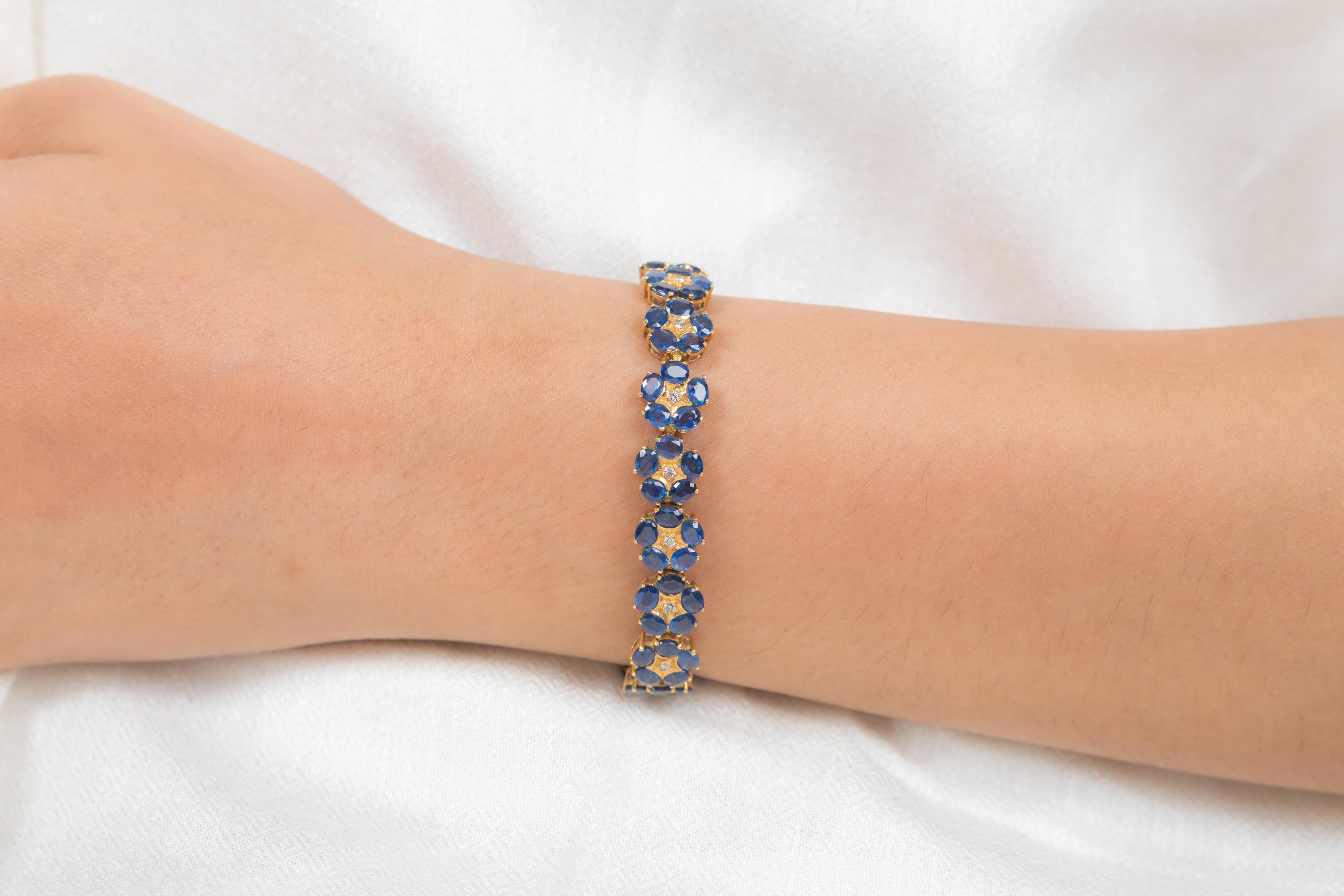 The wearing of charms may have begun as a form of amulet or talisman to ward off evil spirits or bad luck.
This blue sapphire bracelet has a oval cut gemstone arranged in floral shape with diamonds in center in 18K Gold. A perfect piece of jewelry