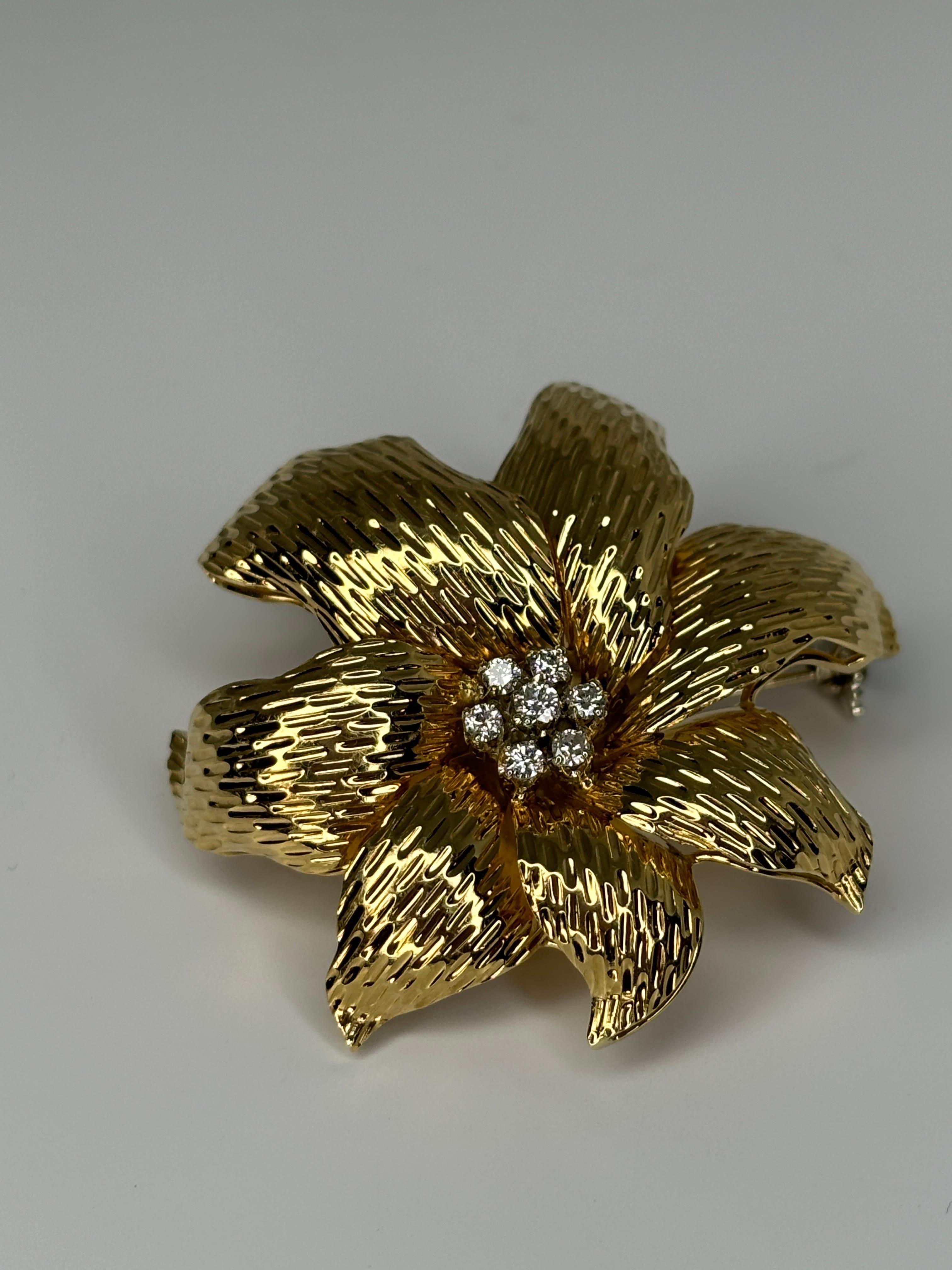 Beautiful 18k gold brooch decorated with diamonds. Great addition to any brooch lover jewelry collection! Very sturdy yet delicate design.

Weight: 13.6 grams
Material: 18k Yellow Gold
Gemstone: Diamond- approximately 0.35 carats
Dimensions: 41.6 mm