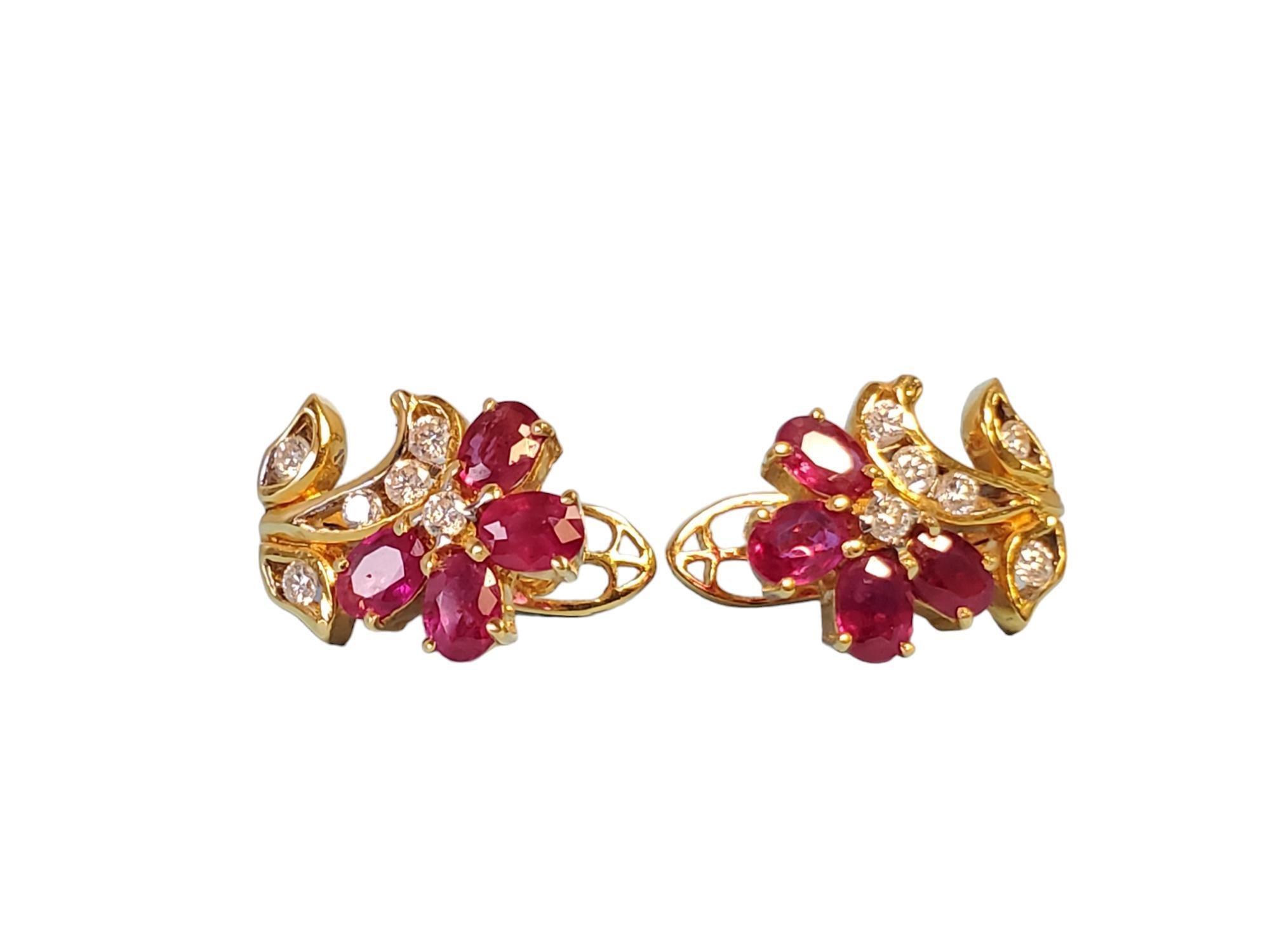 18k Yellow Gold Flower Diamond and Ruby Earrings

Listed are these amazing 18k floral diamond and ruby earrings. They feature a deep yellow gold with .26tcw FG VS round brilliant diamonds acting as the stem of the flower accompanied by 4 natural red