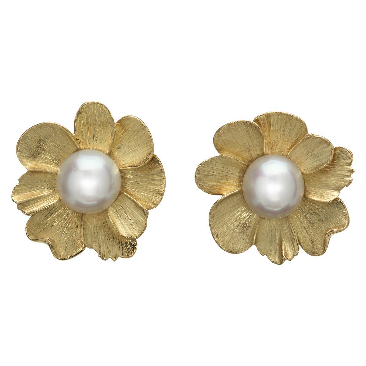 A Nature inspired creation, these 18k yellow gold earrings are matte finished and feature intricately hand-fashioned petals, forming a flower with a bright white South Sea pearl in the center to complete the wondrous design. A simple and elegant set