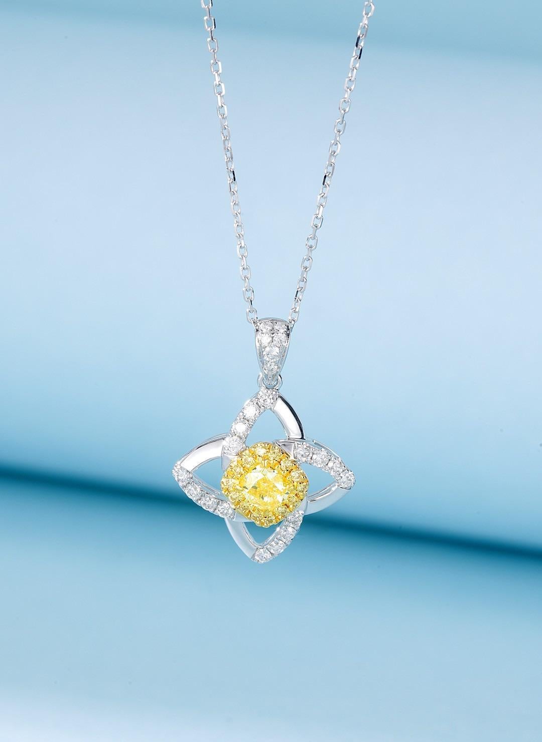 18K Yellow Gold Four-Petal Floral Necklace with Natural Yellow Diamonds

This charming 18K yellow gold necklace features an intricate four-petal floral motif, encrusted with natural yellow diamonds for a dazzling sparkle. The refined craftsmanship