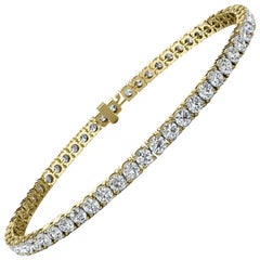 Bracelet tennis à quatre griffes en or jaune 18 carats et diamants 5 carats