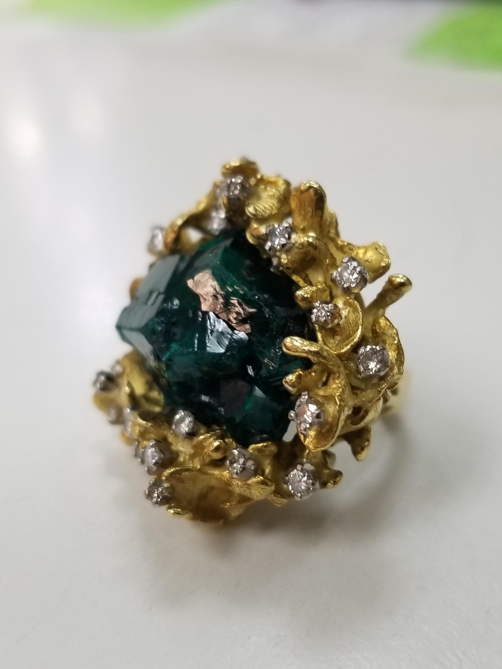 18k yellow gold free form leaf design with Rough Emerald cluster and diamond ring, containing 1 Rough Emerald cluster measuring 28 x 20 x 10 millimeters and 23 round full cut diamonds of very fine quality weighing .55pts. The ring weighs 34.5 grams