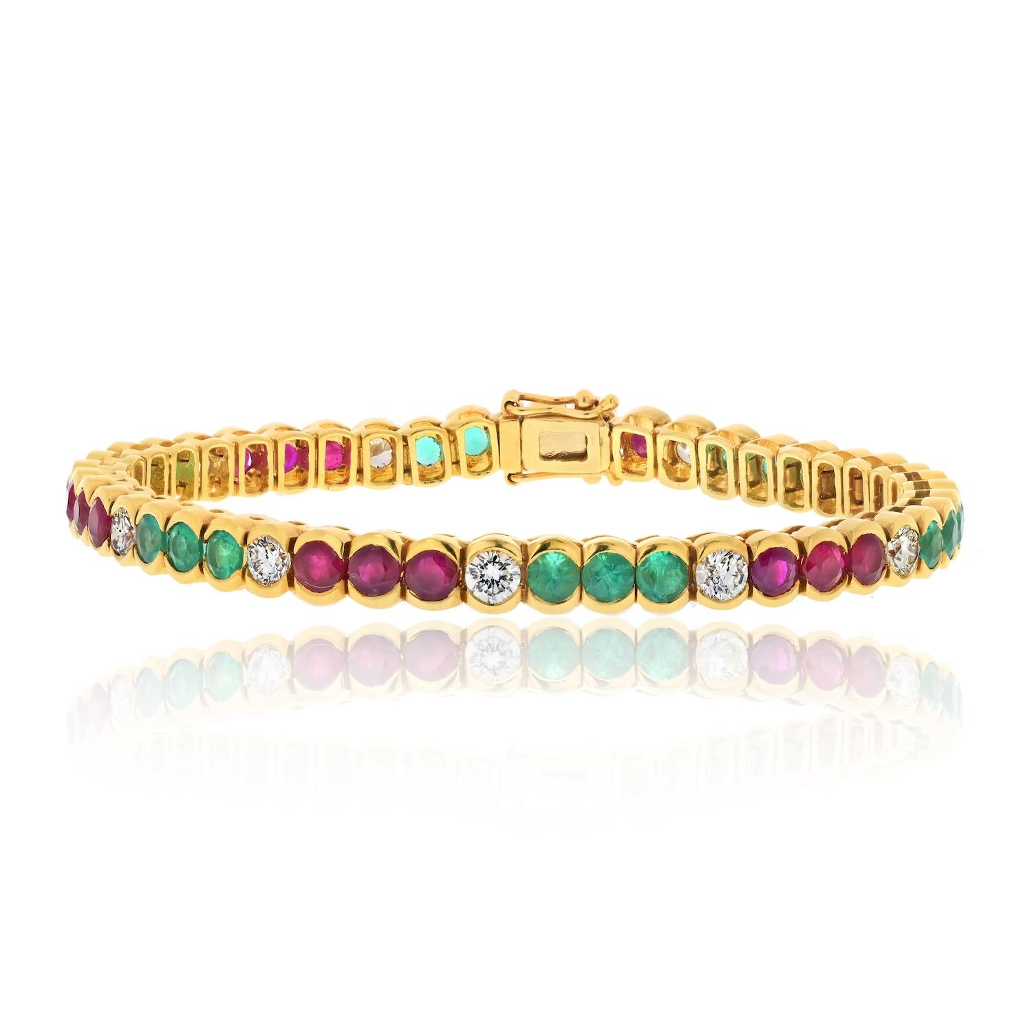 Elevate your wrist with the exquisite beauty of this 18K Yellow Gold Diamond, Emerald, and Ruby Bezel Set Tennis Bracelet. A harmonious blend of vibrant gemstones and brilliant diamonds comes together to create a piece of jewelry that radiates