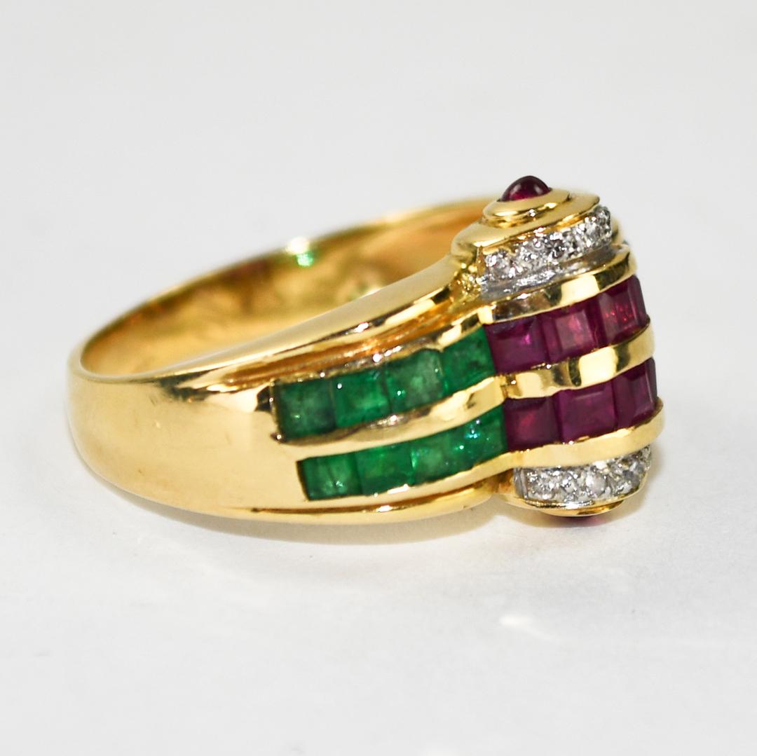 Ladies' 18k yellow gold and gemstone cocktail ring.
Stamped 750 and weighs 6 grams.
There are emerald cut, rubies, emeralds, and blue sapphires.
All natural stones with very good color, .75 total carats.
Tiny diamonds on the sides.
The top of the