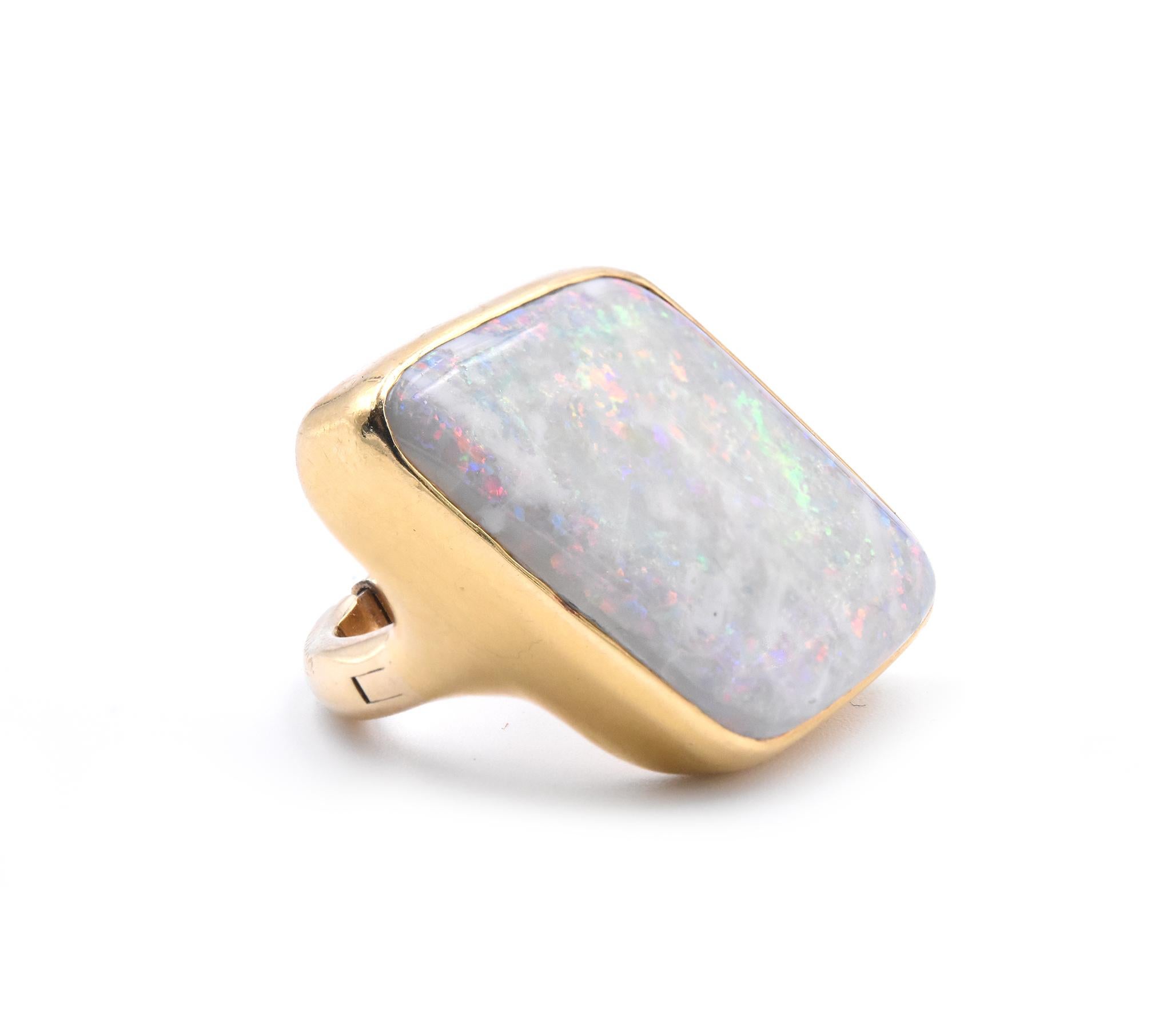 Material: 18k yellow gold
Gemstone: opal 
Ring Size: 4 ½ (please allow two additional shipping days for sizing requests)
Dimensions: ring top measures 33.70mm x 20.10mm
Weight: 23.79 grams
