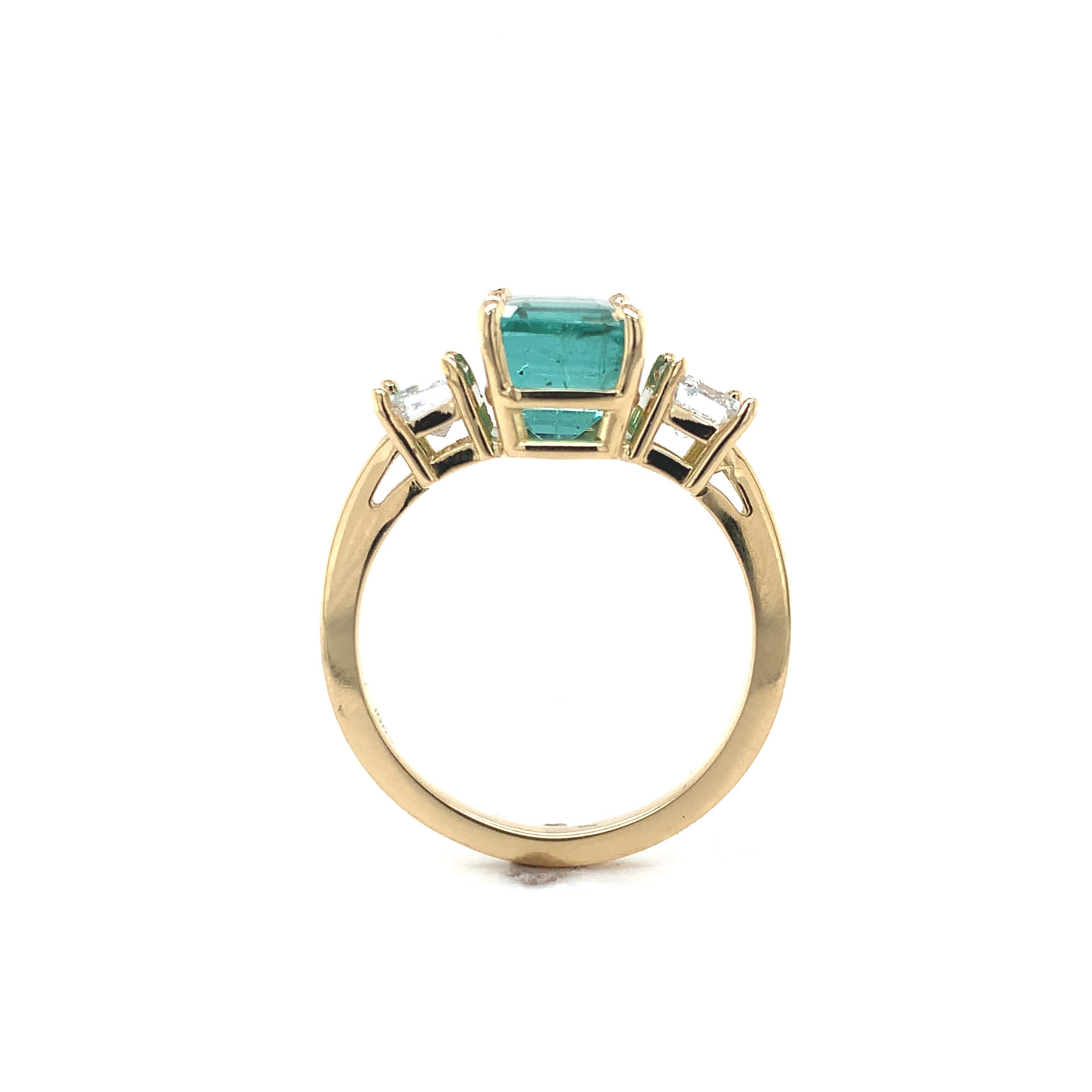 Platinum 3 stone ring featuring a rectangular step cut natural emerald weighing 2.86 carats and diamonds. All 3 stones have GIA reports. GIA report #2239098963 states natural emerald measuring 8.2mm x 7.8 x 6.7mm, stating color of green (with no