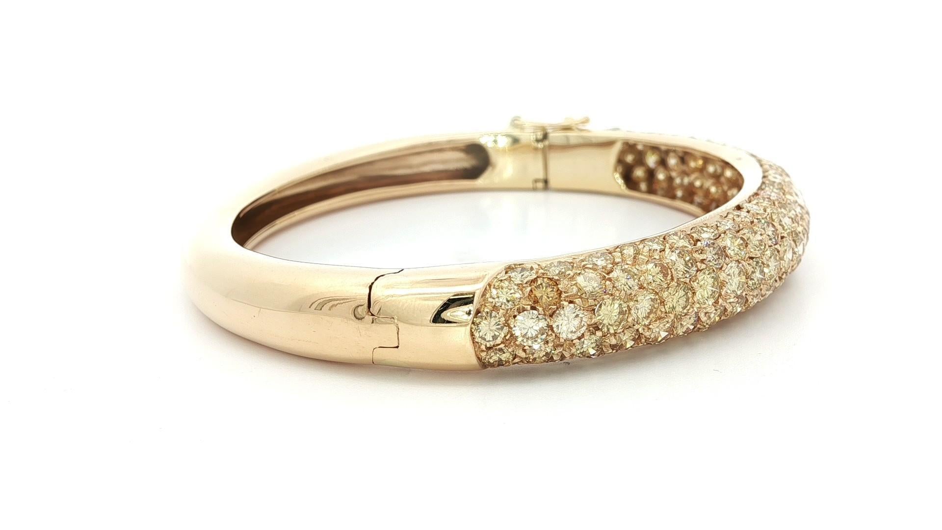 Very High Quality Fancy Yellow Diamond Hinged Open Bangle Bracelet 
--Stone(s):--
Numerous Natural Genuine Diamonds - Round Brilliant Cut - Pave Set - Natural Fancy Yellow to Golden Color - Natural Variation in Colors - VS2 Clarity - 7.20
