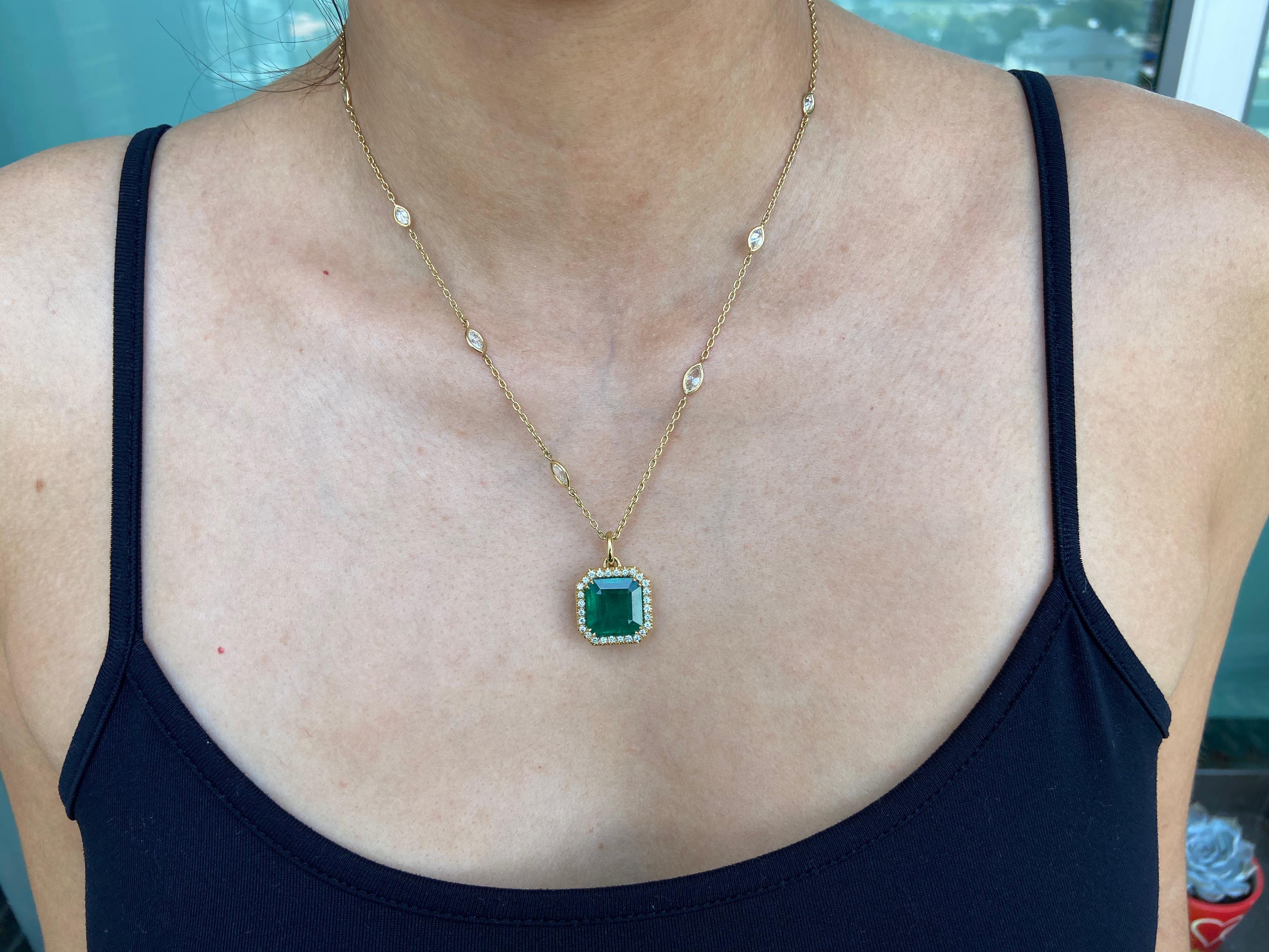 Stunning 18k yellow gold necklace featuring a vibrant green 11.13 carat Zambian emerald and additional 3 carats of diamonds. 
18