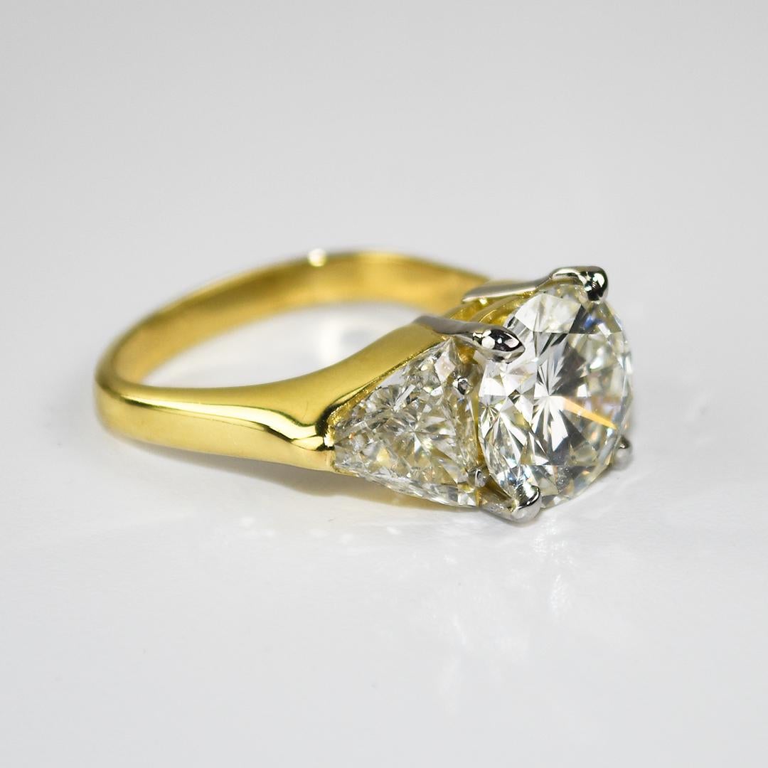 Beautiful 18k yellow gold and diamond engagement ring.
Tests 75% gold using an XRF metals analyzer and weighs 8.4 grams gross weight.
The center diamond is a round brilliant cut 4.33 carats, GIA graded J color, Si1 clarity, good cut.
GIA report