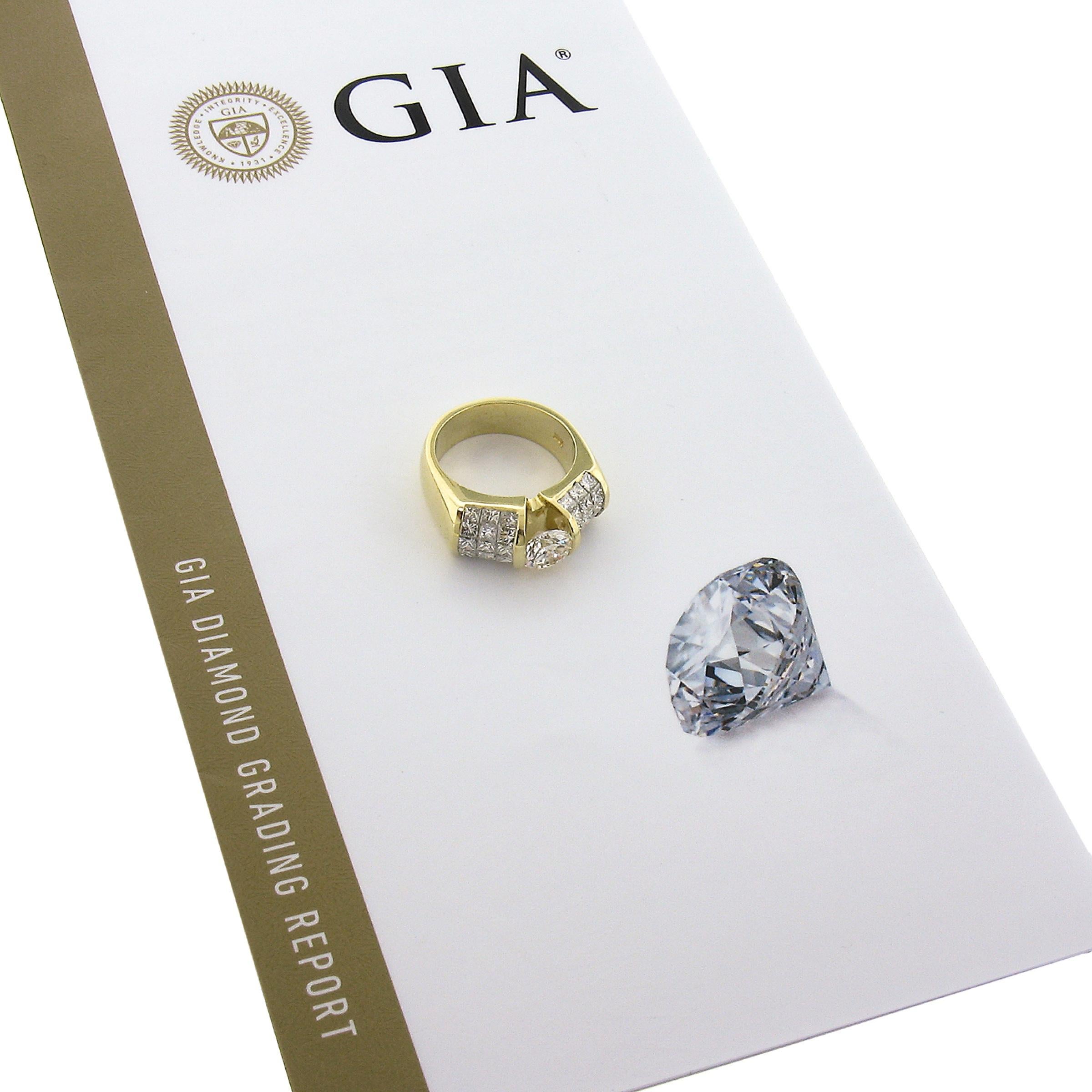 This bold and super brilliant diamond ring is solidly crafted in 18k yellow gold and features a fine quality, GIA certified, 1.02 carat round brilliant cut diamond that beautifully floats at the center of the design. The shoulders are set via
