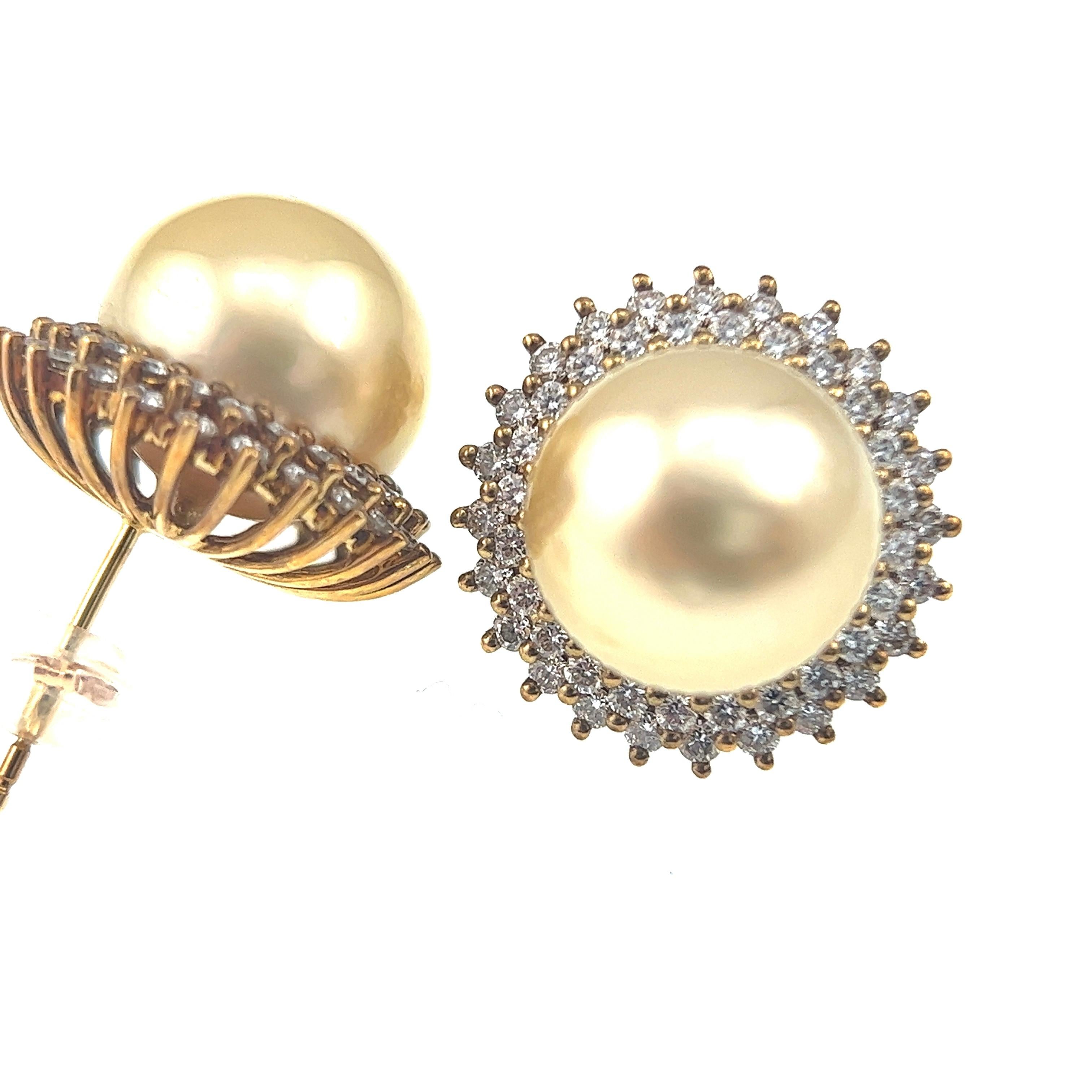 18K Yellow Gold Golden South Sea Pearl & Diamond Earrings

96 Diamonds - 1.299 CT
South Sea Pearl - 12mm

These exquisite earrings feature lustrous golden South Sea pearls, renowned for their rich color and unparalleled luster. Each pearl is
