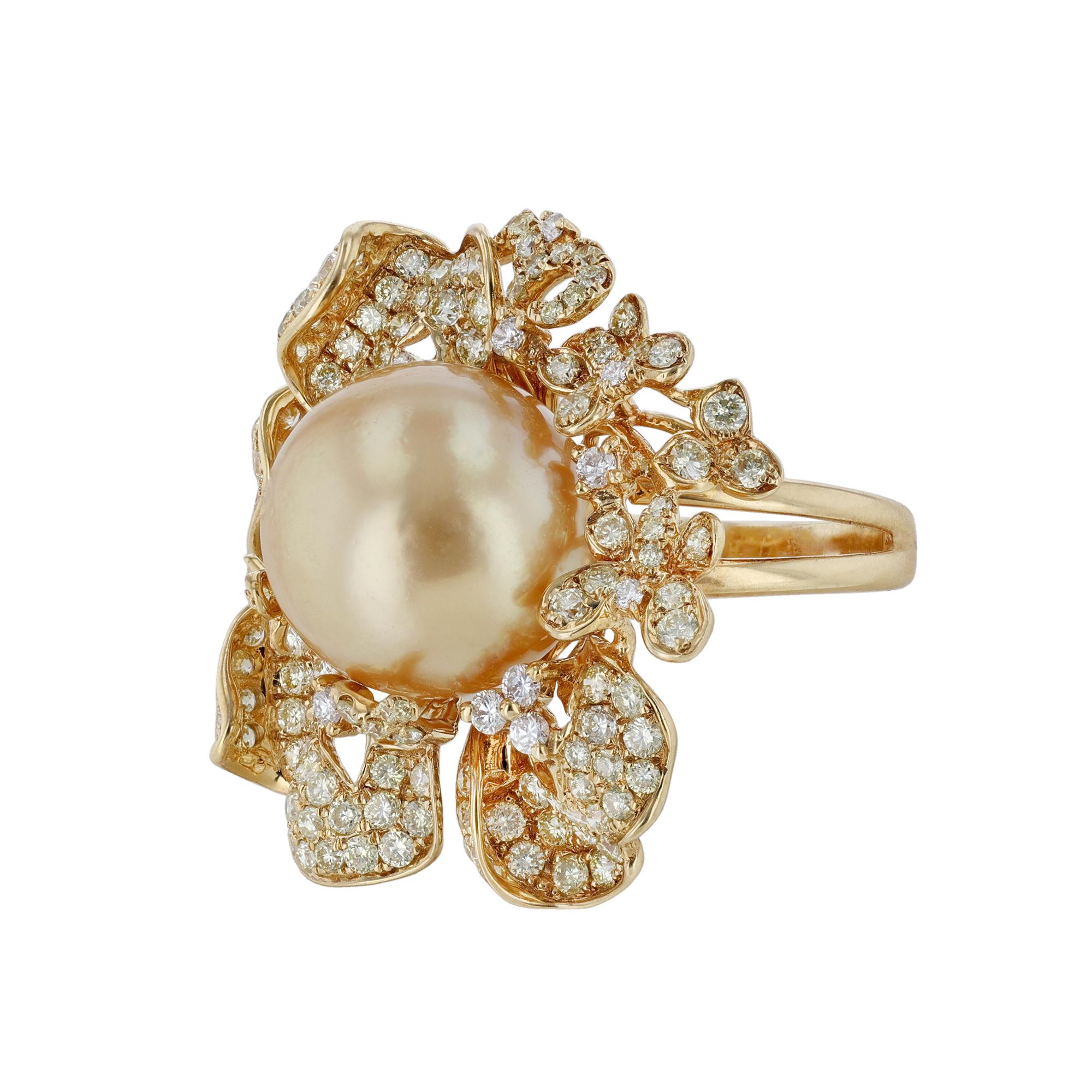 This ring is made in 18K yellow gold and features a 13.50 millimeter Golden South Sea Pearl. Surrounded by a floral with butterflies motif of 143 yellow weighing 2.03 carats and 13 white round cut diamonds weighing 0.24 carats. 