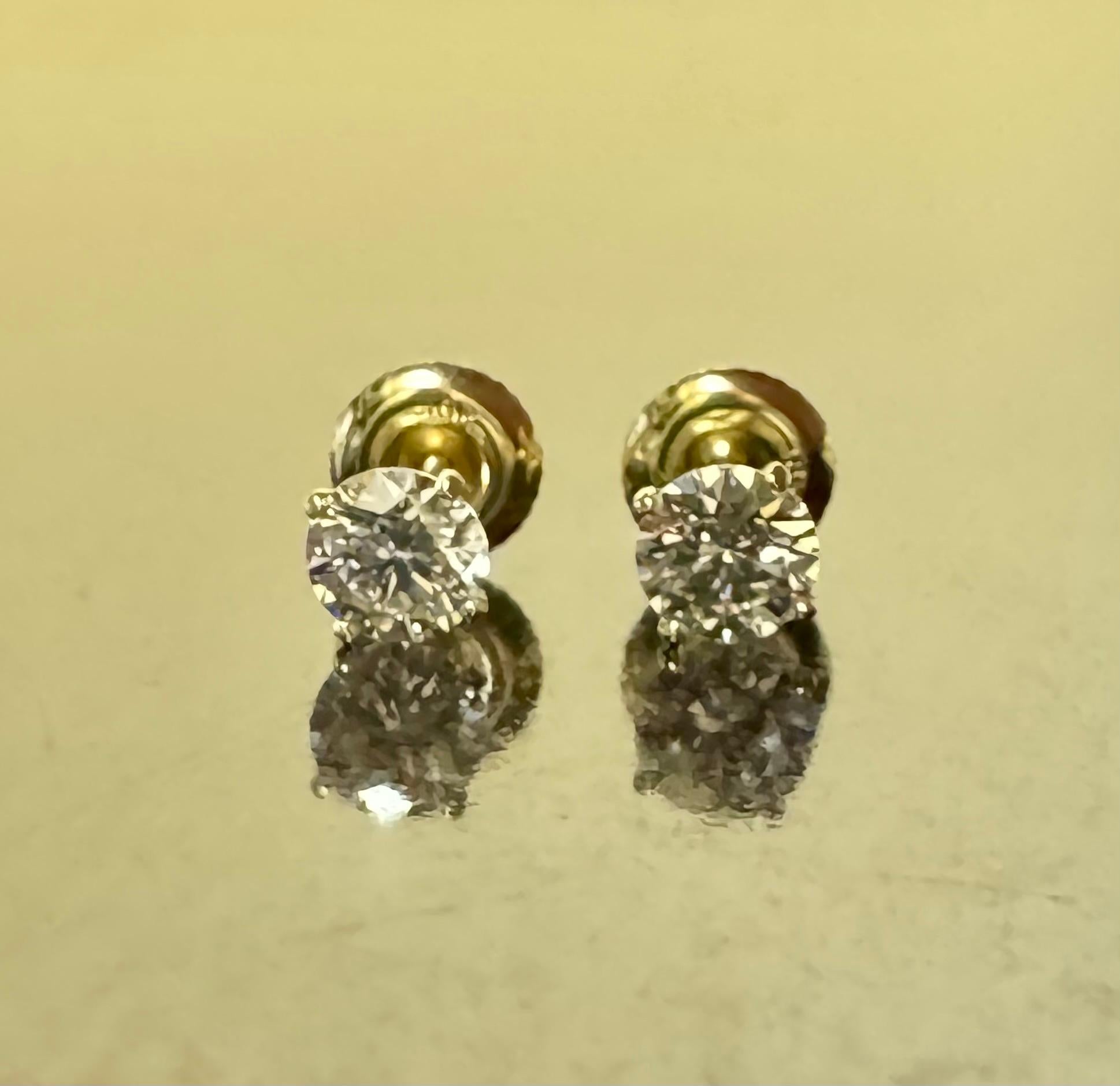 Modern 18K Yellow Gold H Color VS1 GIA Certified 1.10 Carat Diamond Stud Earrings For Sale