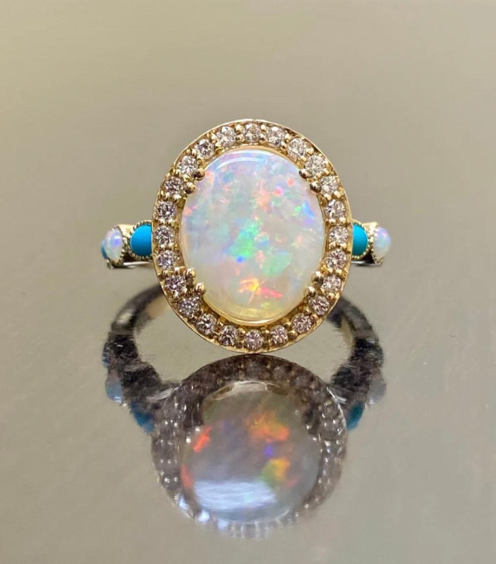 DeKara Designs Collection

Metal- 18K Yellow Gold, .750.

Stones- Center Features an Oval Fiery Australian Opal Cabochon Cut 12 x 10 MM 2.20-2.50 Carats, Four Marquise Turquoise, Two Round Opals, 30 Round Diamonds F-G Color VS2 Clarity, 0.40