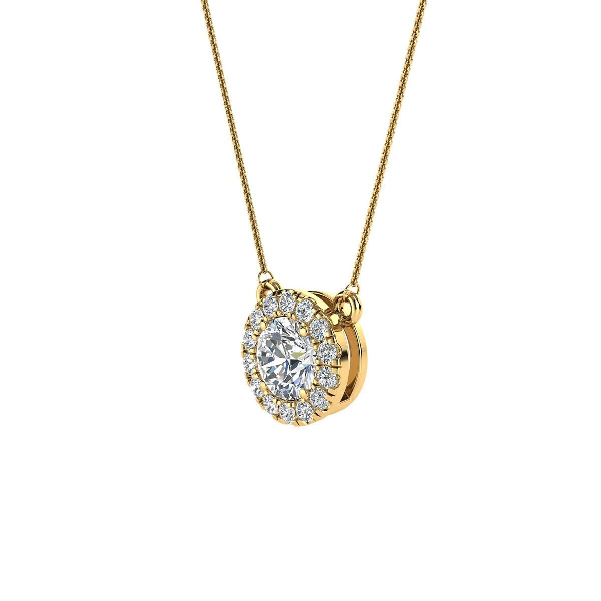 This delicate pendant feature one round shaped diamond that is approximately 0.35-carat total weight (4.5 mm) encircled by a halo of perfectly matched 14 brilliant round diamonds in about 0.14-carat total weight. The earrings are measuring at 7.5 mm