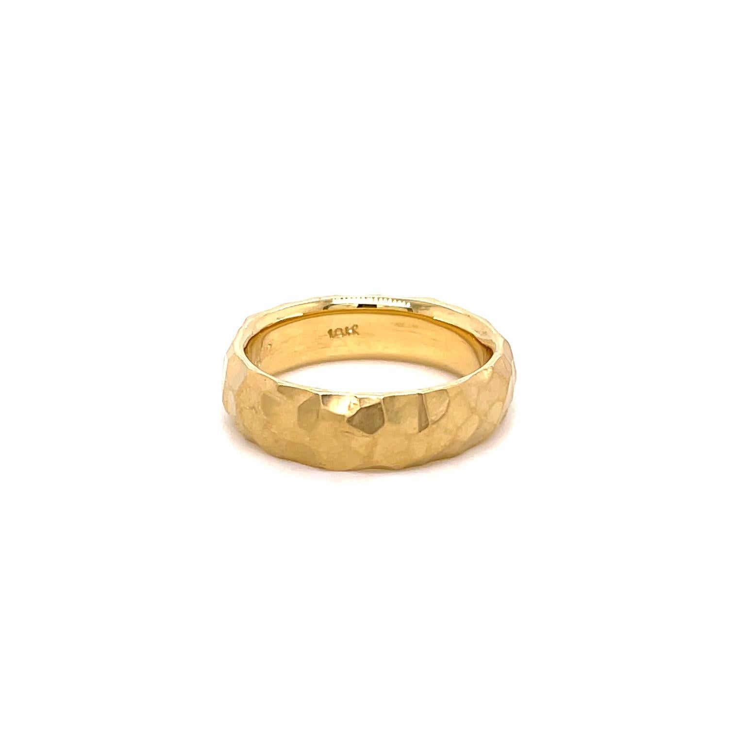 An 18k yellow gold 6mm hammered gents band. Ring size 9. This ring was made and designed by llyn strong.