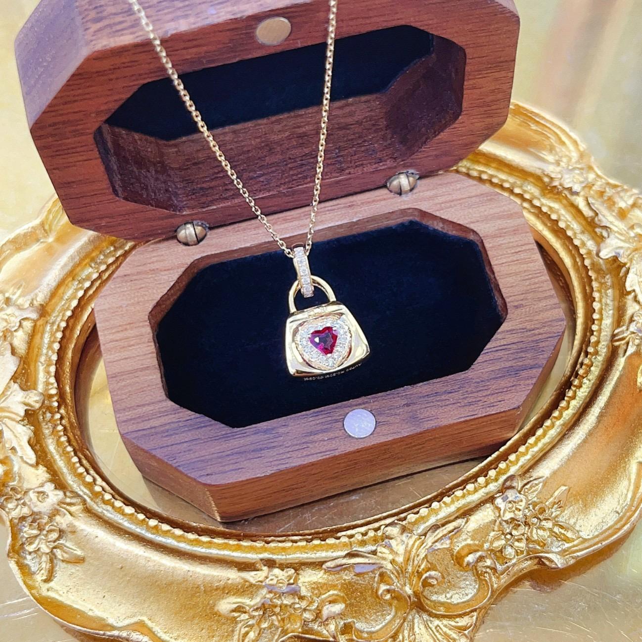 Modern 18K Yellow Gold Hear-Cut Ruby & Diamond Bag Pendant Necklace For Sale