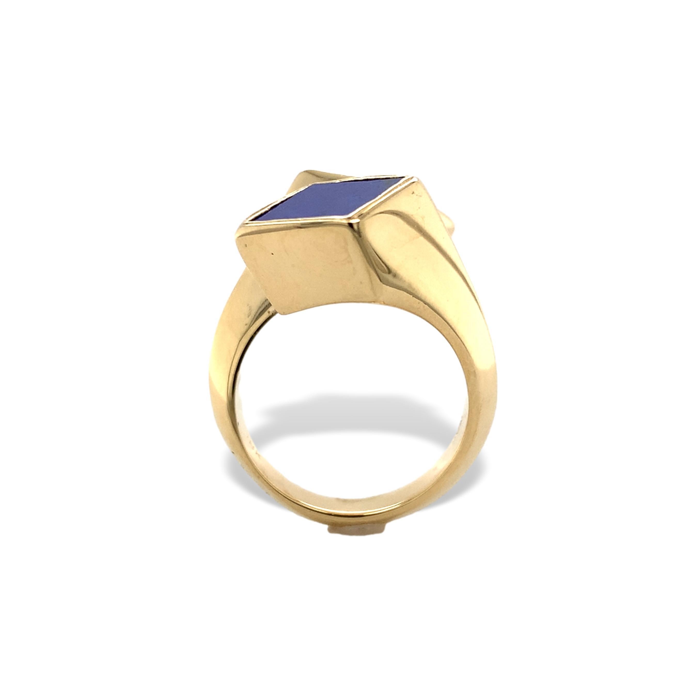 18K yellow gold mid-century modern lapis bypass ring. The ring has 2 square cut genuine earth mined lapis. The lapis is royal denim blue with some pyrite flecks and measures about 8mm.  The ring measures 7/8