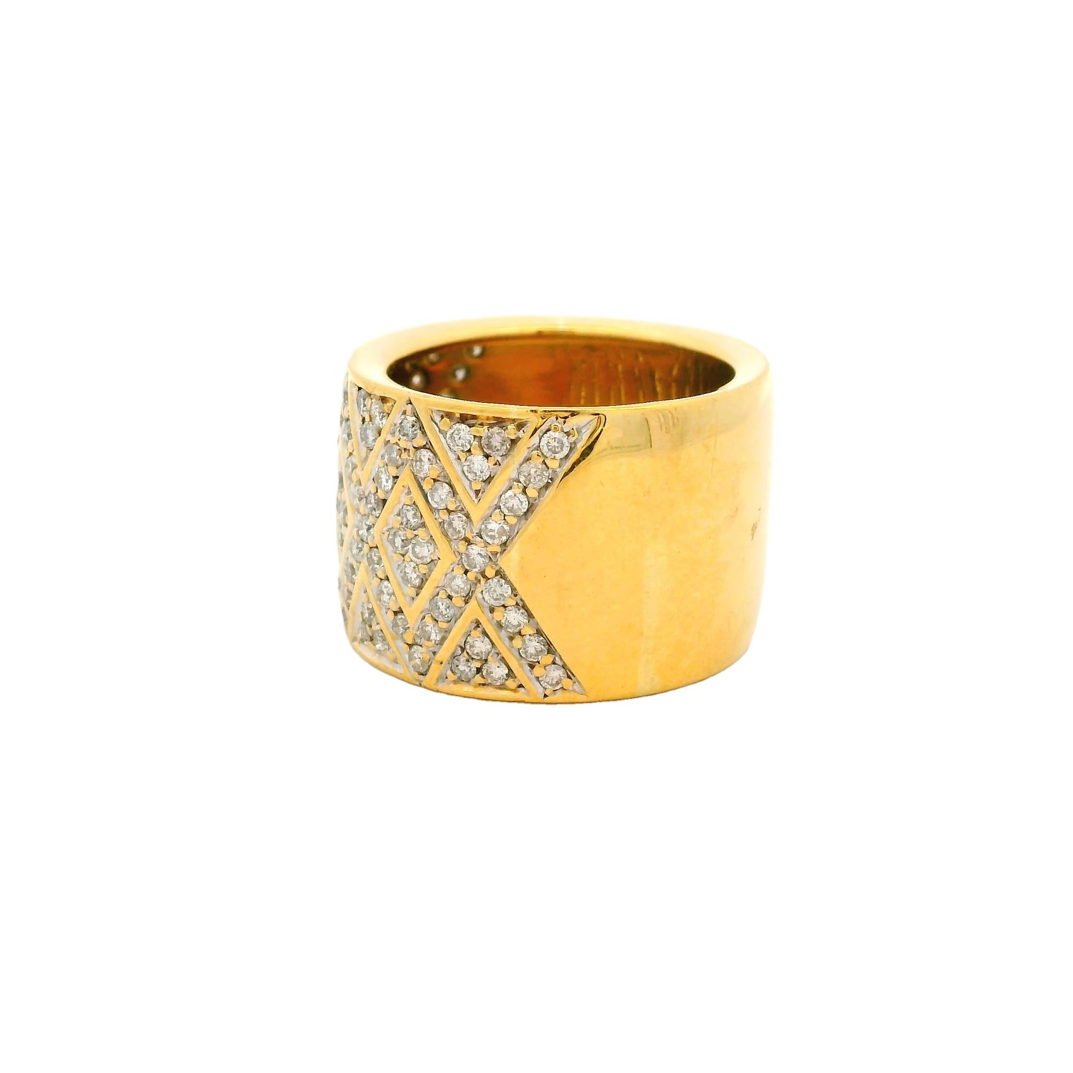 A bold expression of modern elegance, this 18K yellow gold wide band ring showcases a striking hexagonal lattice design, pavé-set with approximately 1.5 carats of brilliant-cut diamonds. Weighing 12.33 grams, the ring balances architectural