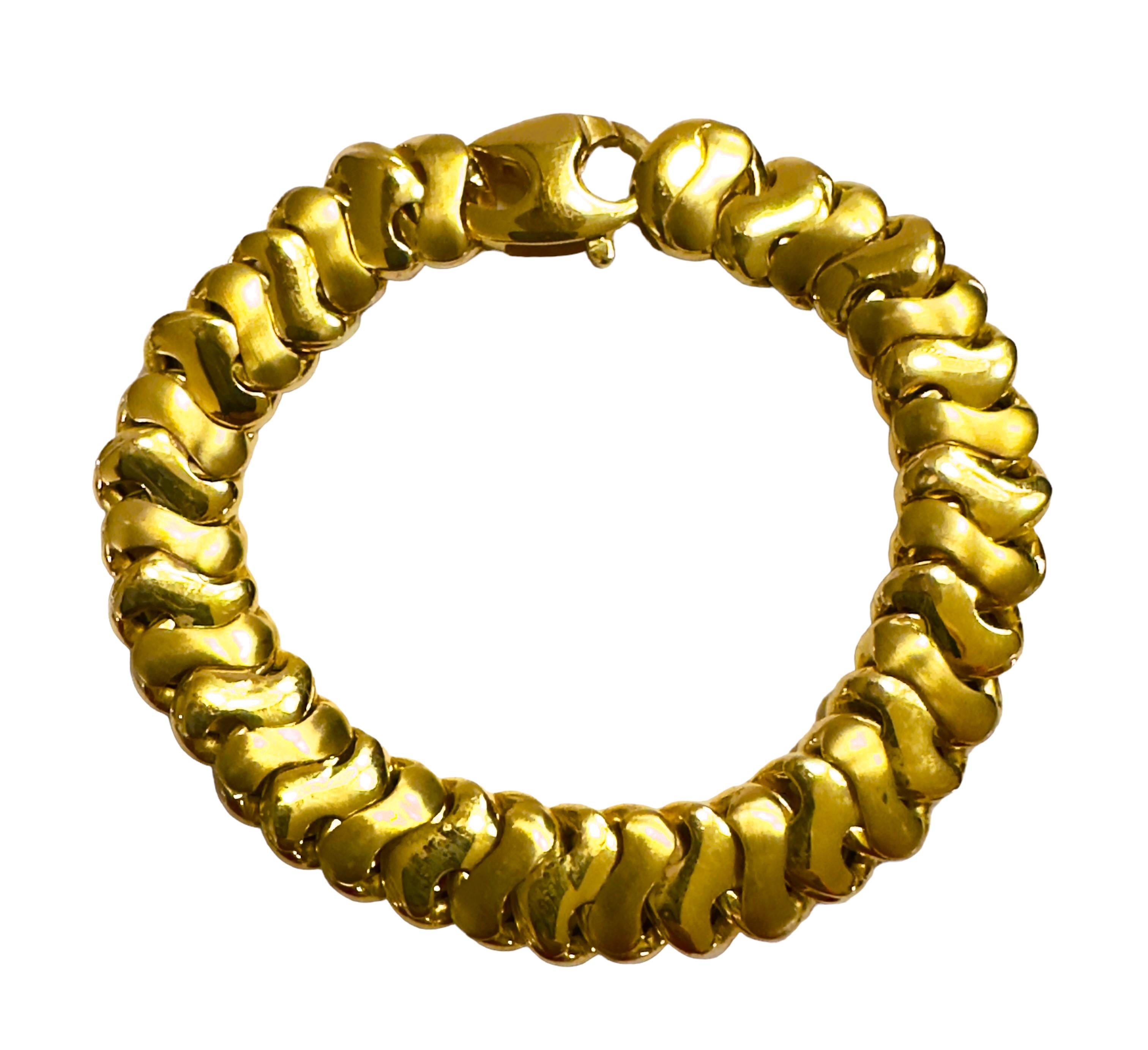 This bracelet is just so beautiful!!  It is a high polish necklace but on one side it is finish and on the other side there is Alternating High Polish links with Brush Gold links.   It looks great either way.  It feels just smooth and silky on your