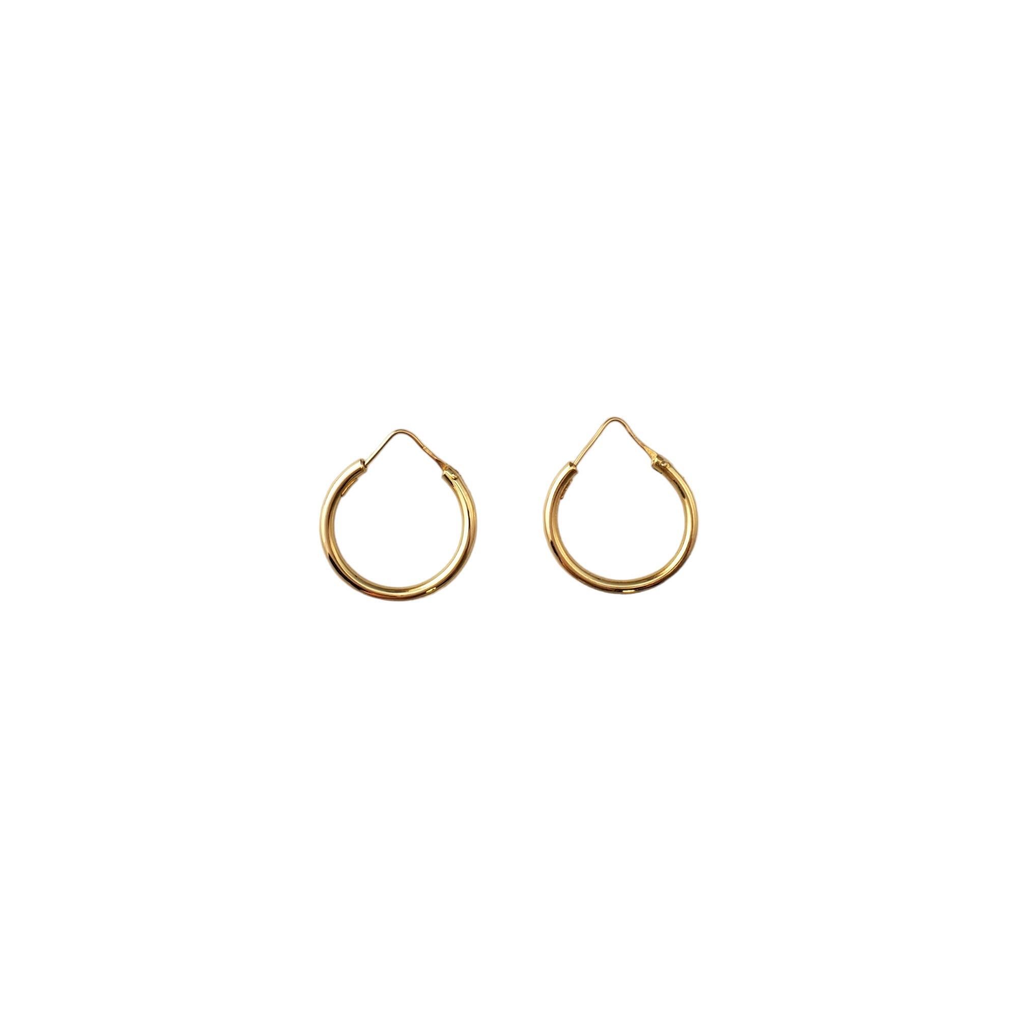 18K Yellow Gold Hoop Earrings 

These classic earrings are a staple to your collection. 

Size: 26.8mm X 2.3mm X 2.5mm

Weight: 1.5dwt. / 2.3 gr.

Marked: 750

Very good condition, professionally polished.

Will come packaged in a gift box or pouch