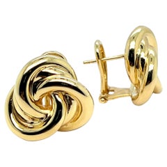 Orecchini a cerchio in oro giallo 18K con charme