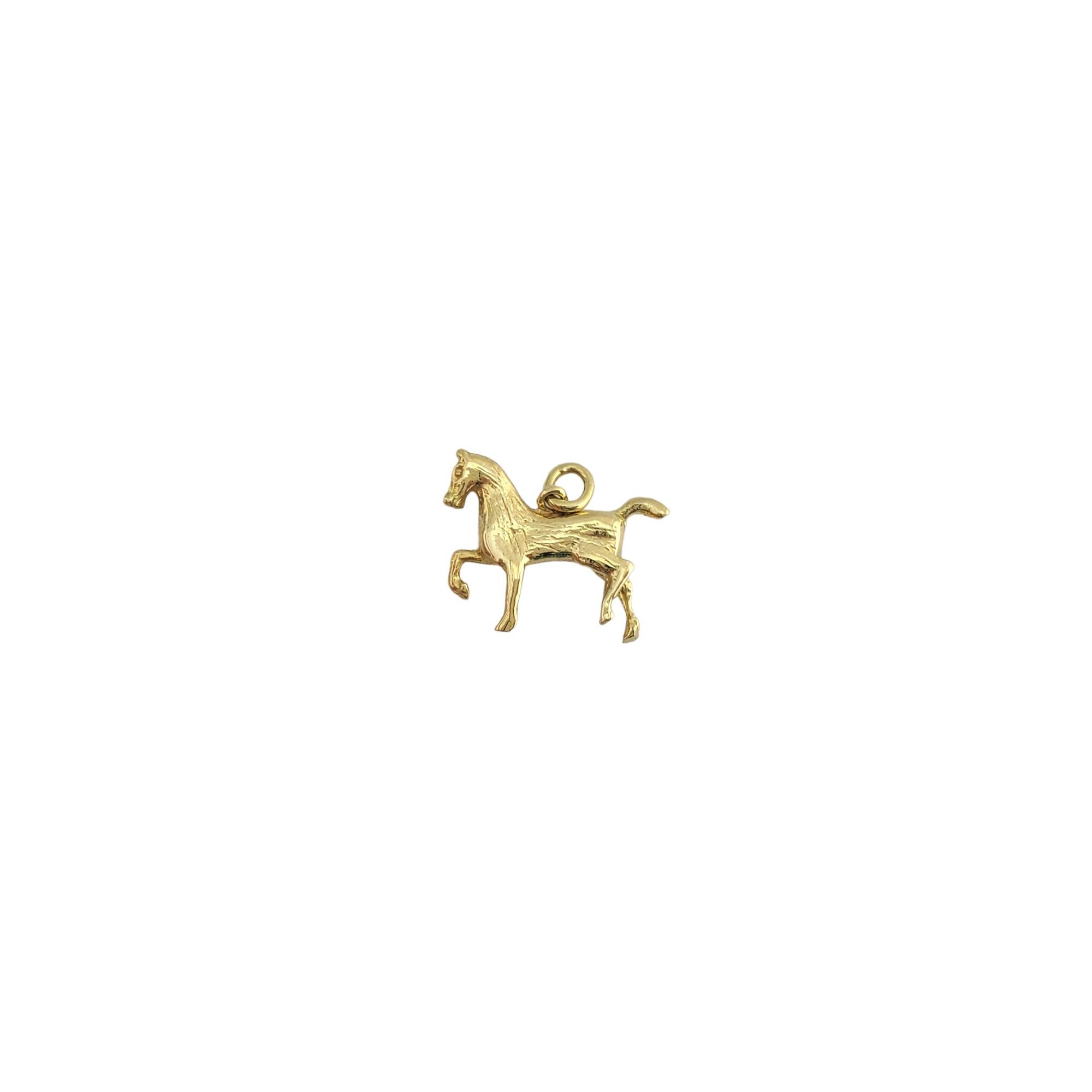 Vintage 18K Yellow Gold Horse

Beautiful 18K gold horse in a trot.

Size: 20mm X 11.92mm

Weight:  3.7g / 2.3dwt

Very good condition, professionally polished.

Will come packaged in a gift box and will be shipped U.S. Priority Mail