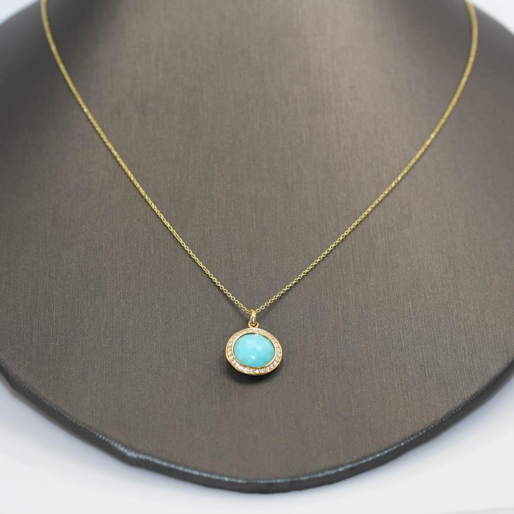 Ladies Ippolita designer turquoise and diamond necklace in 18k yellow gold.
Stamped ippolita 18k on the edge of the pendant and 18k on the chain clasp.
Gross weight is 2.7 grams.
The pendant measures 13mm wide and contains a faceted turquoise.
On