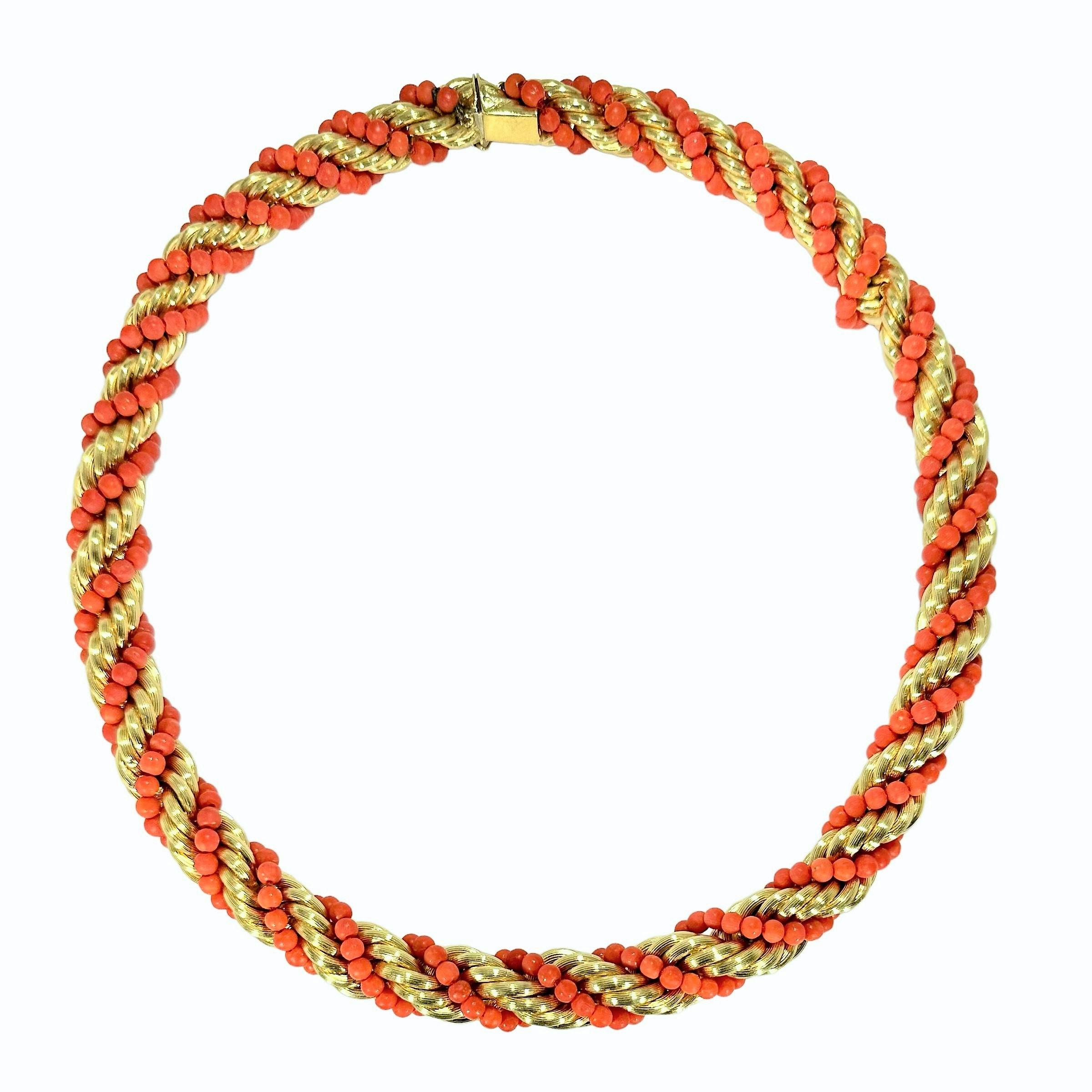 Crafted at some point during the middle of the 20th century, undoubtedly in Italy, this very substantial 18K yellow gold fluted link, coral wrapped rope necklace has a hefty weight and feel.
Measures 18 1/2 inches in length and graduates ever so