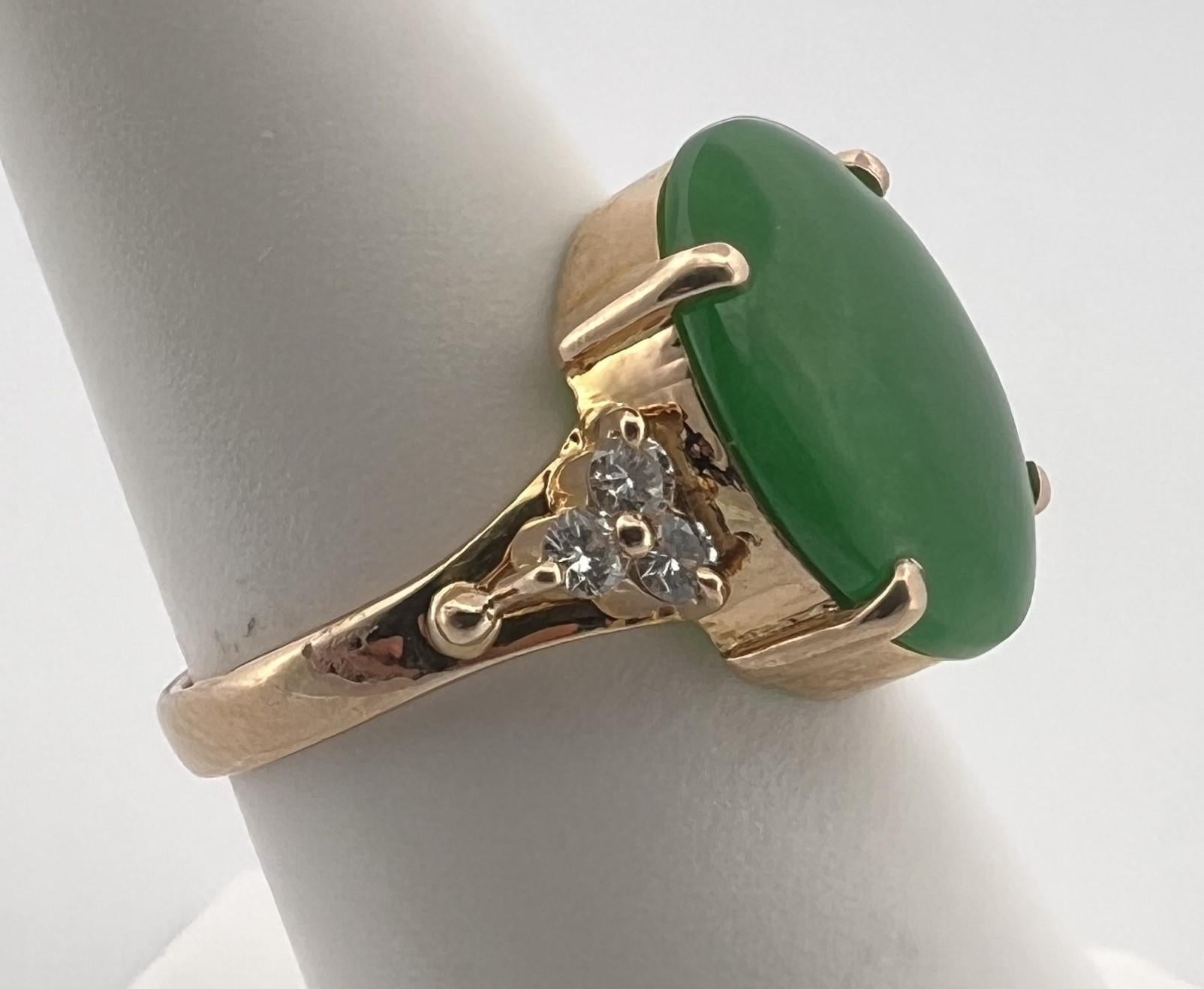 Green Jade Weight: 7.50ct

Diamond Count: 6 Round Brillant Diamonds

Diamond Weight: .80ct 

Diamond Color: F-H

Diamond Clarity: SI1-SI2

Ring Size: 4.5

Item Weight: 5.4 grams 

Stamped: 18k

Condition: Excellent 
