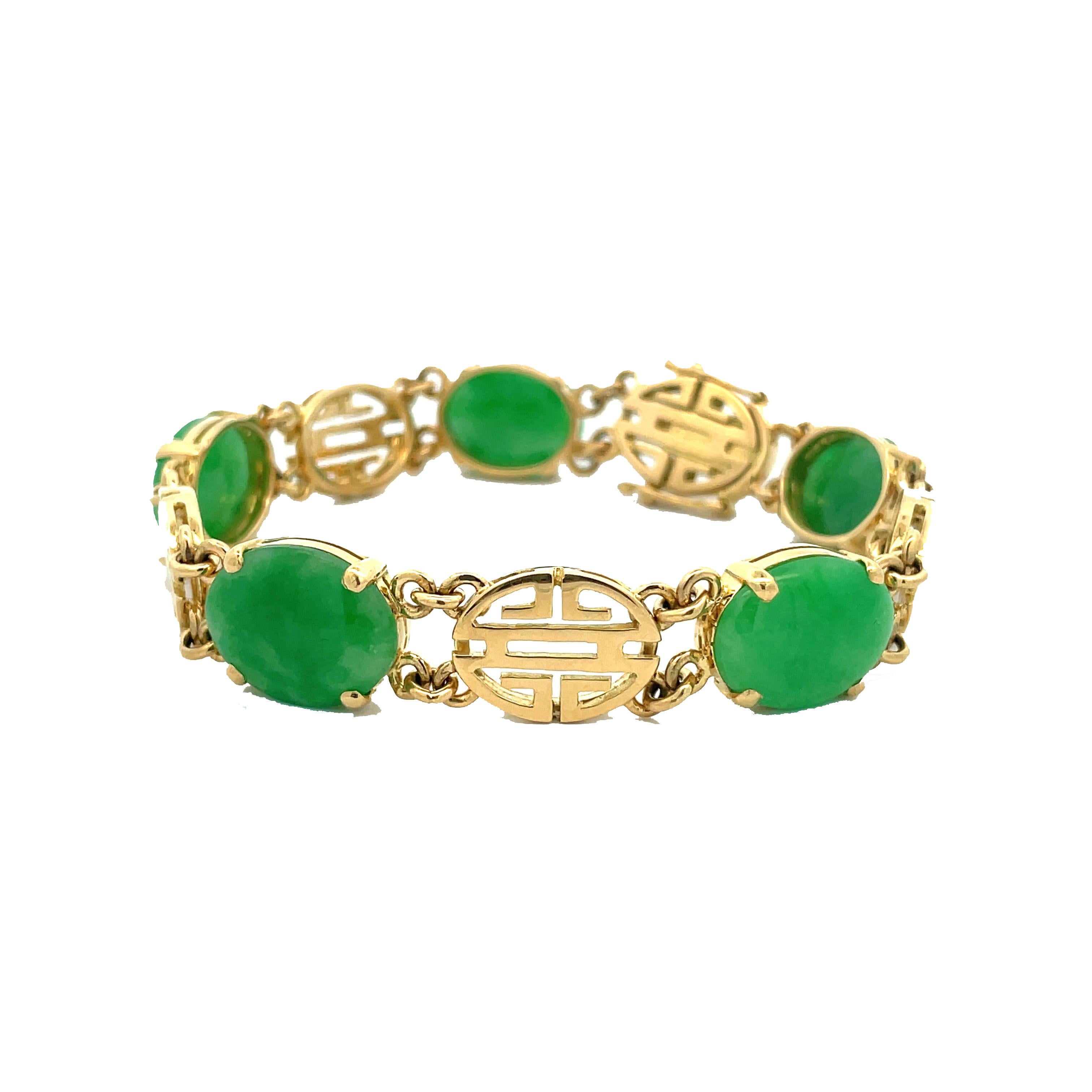 This is a stunning bracelet crafted in beaming 18K yellow gold that showcases a beautiful collection of rich green Jadeite Jade oval cabochons accompanied by a GIA Report. In this exceptional and exceedingly beautiful 18K yellow gold setting, a