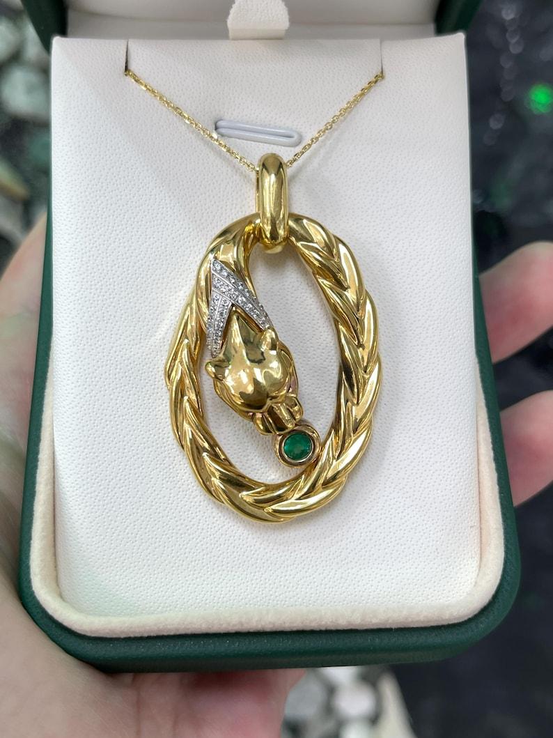 Behold the allure of our 18k yellow gold jaguar pendant, weighing a delicate 7 grams. Adorned around the jaguar's neck, a diamond V-shaped collar steals the show. This collar features pave-set brilliant round-cut synthetic cubic zirconias that