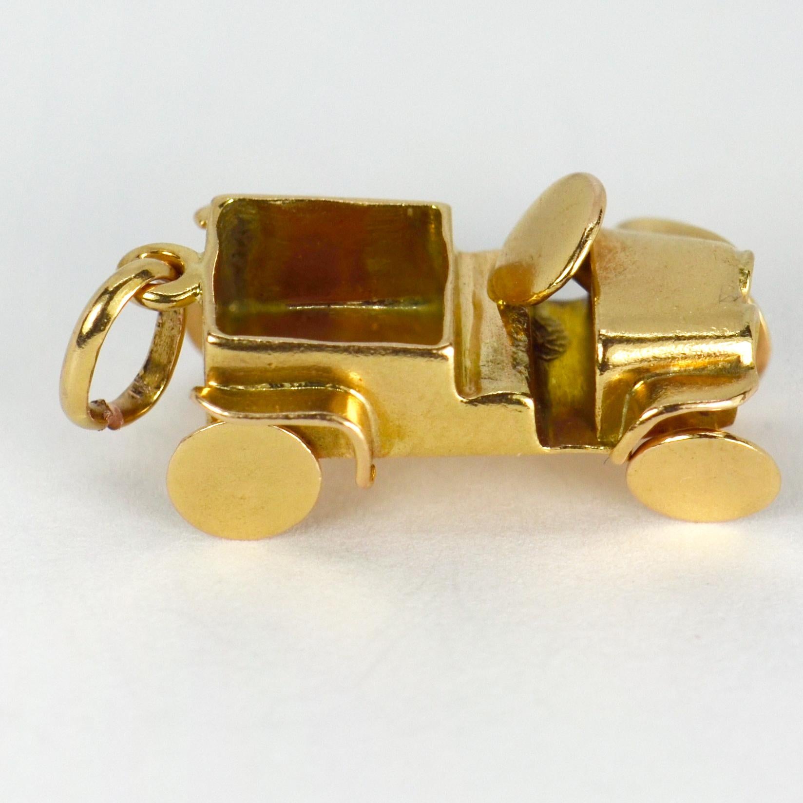 An 18 karat (18K) yellow gold charm pendant designed as a jeep car with moving wheels. Unmarked but tested for 18 karat gold. 

Dimensions: 2 x 1.1 x 0.85 cm
Weight: 2.87 grams
