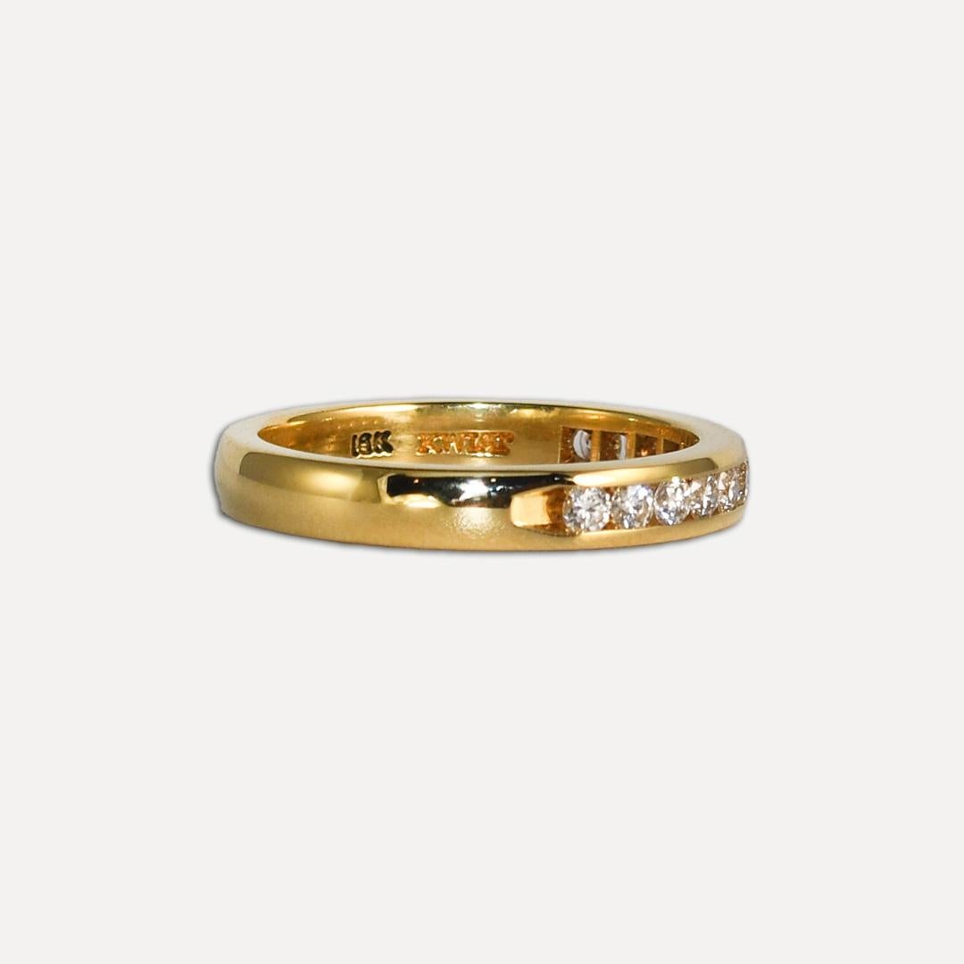 Ladies' 18k yellow gold diamond band.
Stamped 18k and weighs 2.8 grams.
The diamonds are round brilliant cuts, approximately .25 total carats, G to H color, Vs-Si clarity, and very good symmetry.
The band measures 2.8mm wide.
The ring size is 5 and