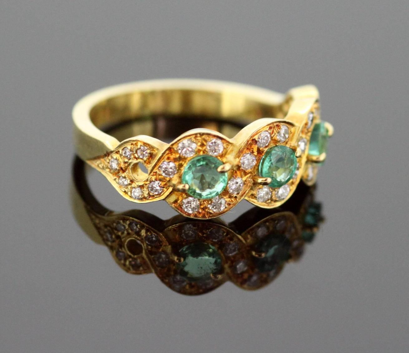 Vintage 18K Yellow Gold Ladies Ring With Emerald (0.75 CT Total) and Diamonds (0.30 CT Total) 
London 1989
Maker : HAP
Fully hallmarked.

Dimensions -
Finger Size: (UK) = O (US) = 7 1/2 (EU) = 55 1/4
Ring Size : 2.3 x 2.3 x 0.8 cm
Weight: 5 g