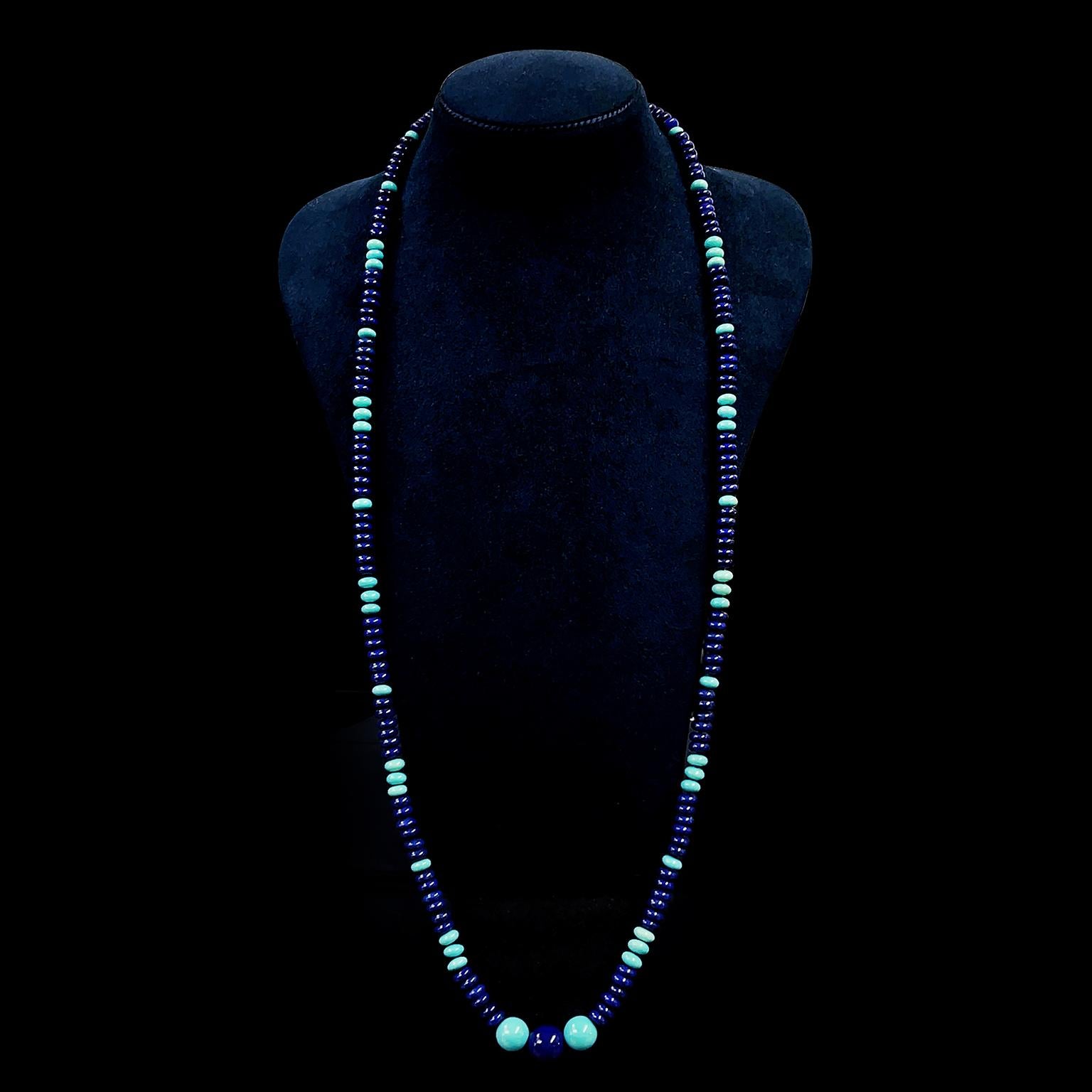 Vivid blues of lapis and turquoise create this complementary necklace. Dark thread collects each gem with a knot in between to ensure protection. Rondelles of lapis begin the pattern. Cool hues of turquoise rondelles alternate individually and in