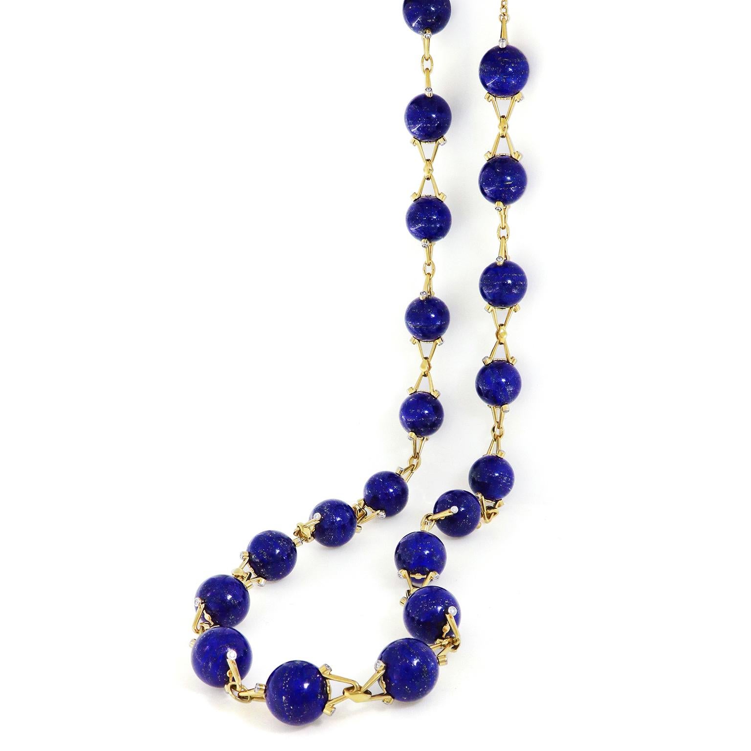 The breathtaking cobalt lapis surges throughout this 18k yellow gold necklace. Orbs of the gemstone are joined together by gold V links with a brilliant-cut diamond on each side. This rich precious metal lifts the delicate golden flecks organic to