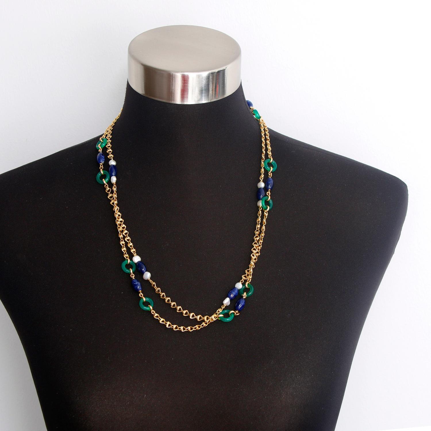 gold chain with green stone