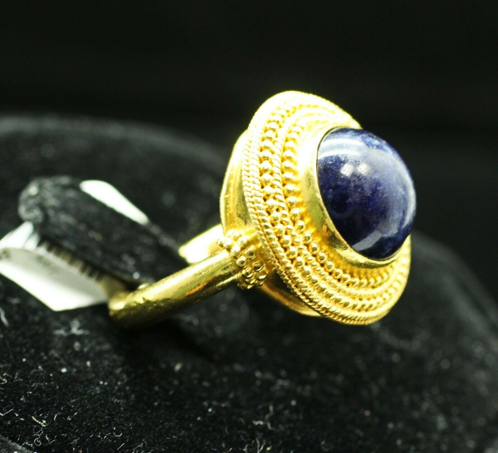  
Specifications:
    STONE: ROUND BLUE LAPIS LAZULI 11.20MM
    type: VINTAGE STYLE
    metal: 18K YELLOW GOLD
    SIZE: 3.25
    WIDTH/THICK: 119.6MM-11.25MM
    WEIGHT: 9.97GRS