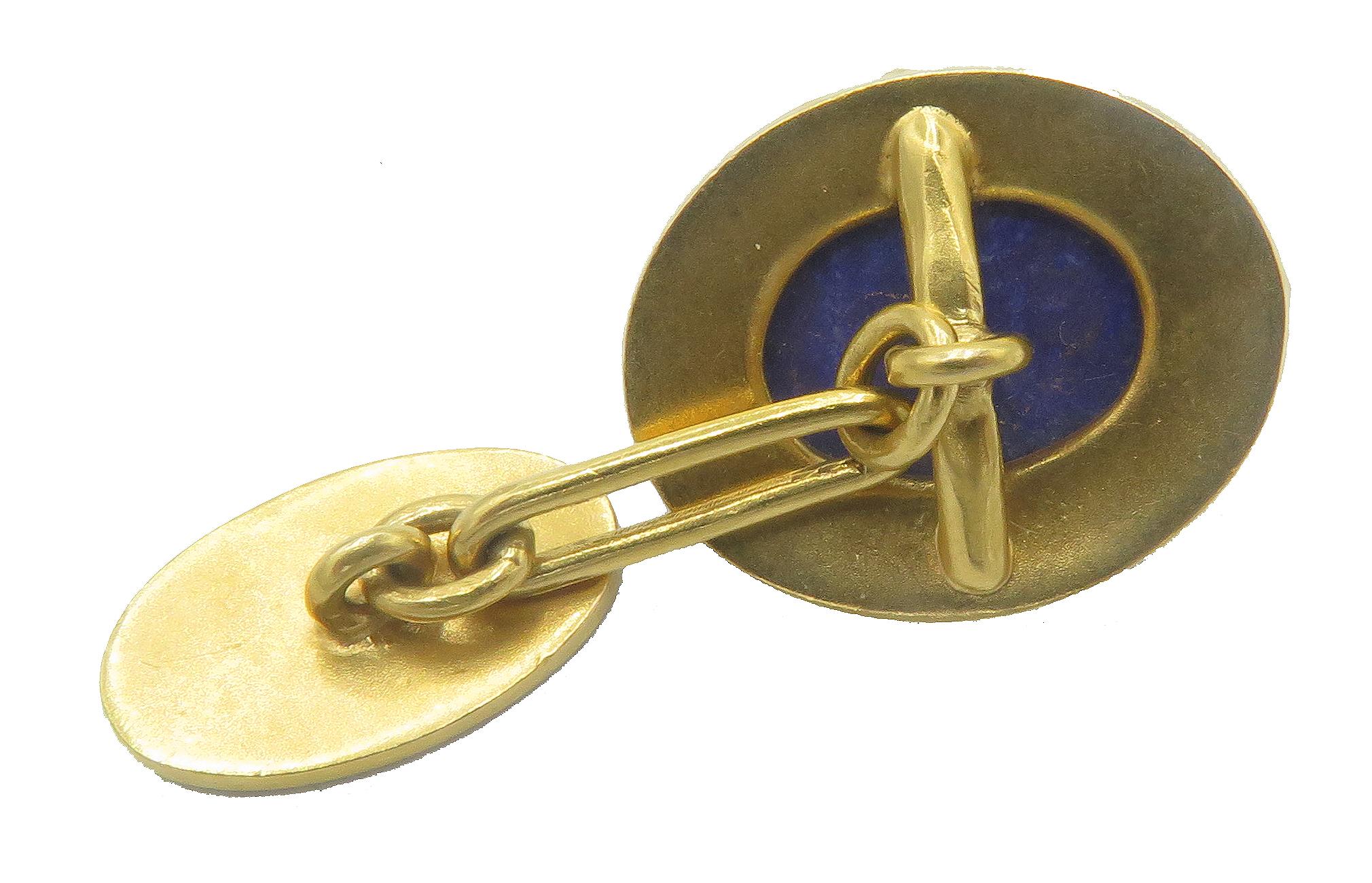 An, elegant cuff links set in 18kt yellow gold. The, cuff links also feature a blue lapiz lazuli and enamel. The, cufflinks only weigh 10.7 grams  and 1.25