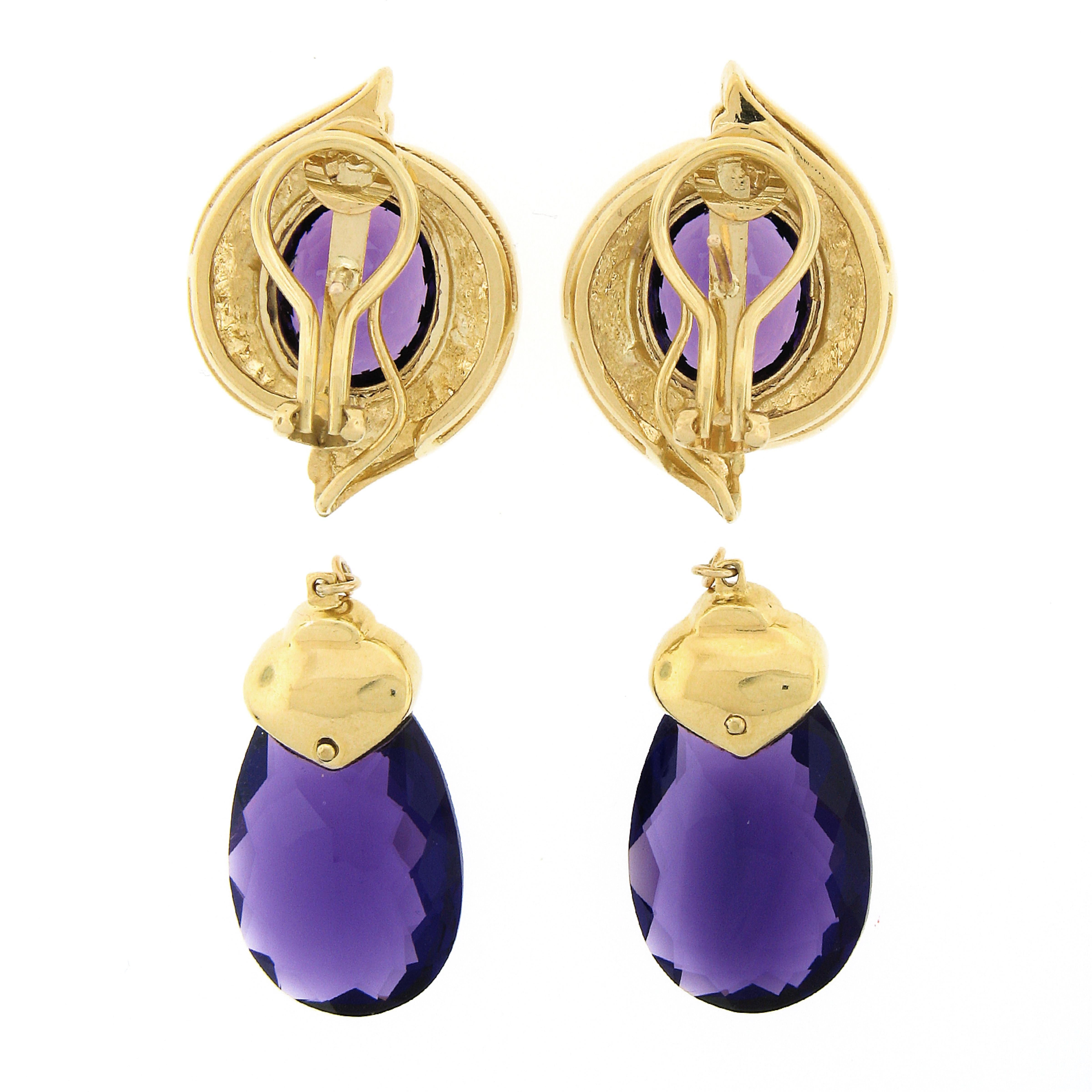 This stunning and truly magnificent pair of amethyst and diamond enhancer earrings is crafted from solid 18k yellow gold and features an absolutely bold and elegant design. The amethyst stones on this pair of earrings are HIGH QUALITY, and are are