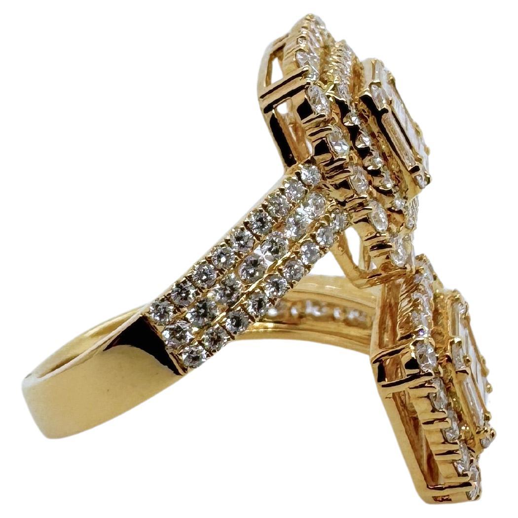An unusual diamond bypass ring that will captivate everyone's attention.   Uniquely made in 18k yellow gold, it has a total of 2.43 cts of round diamonds and diamond baguettes.  This statement piece will be thoroughly enjoyed in any jewelry